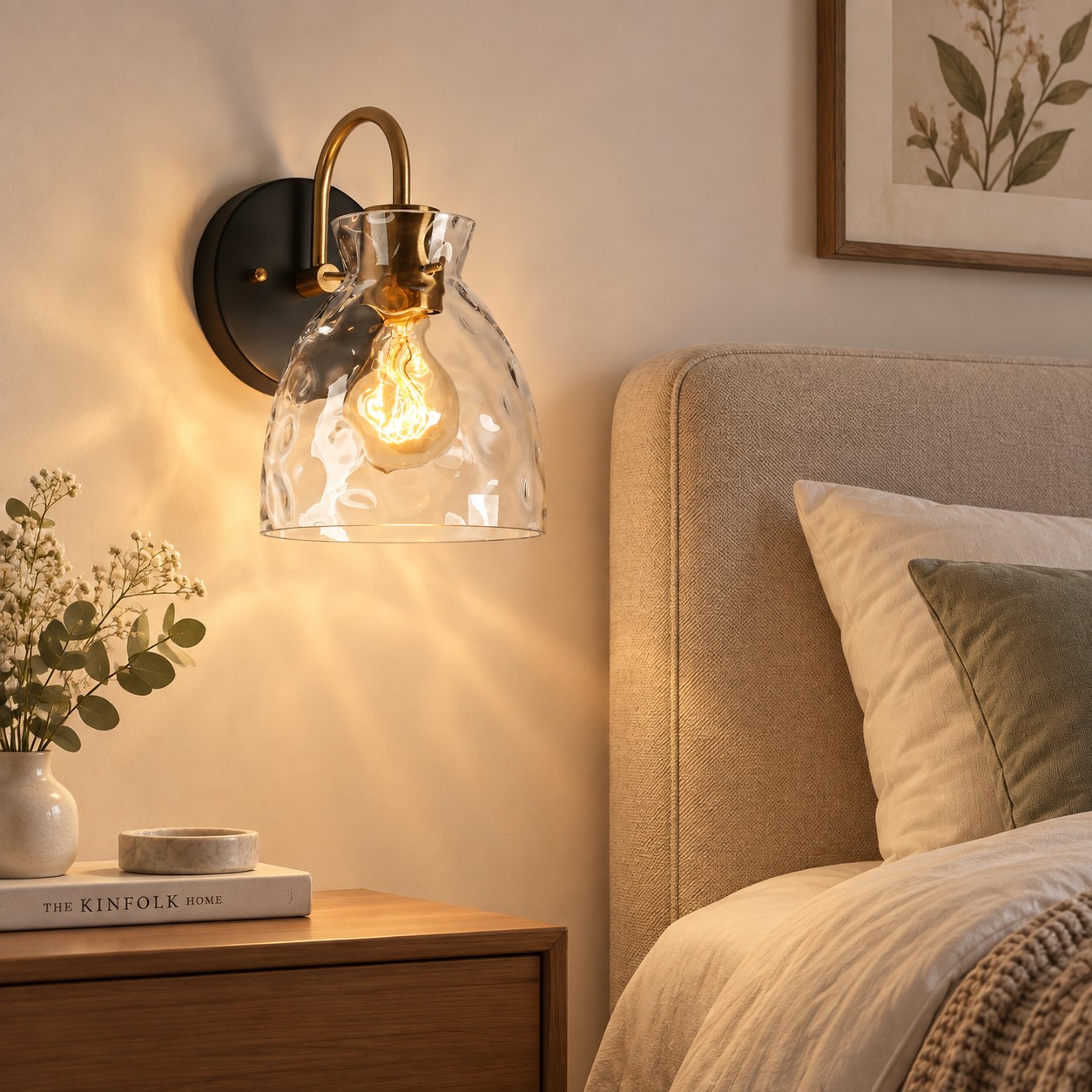 Textured Glass Wall Sconce with a clear shade and a curved arm
