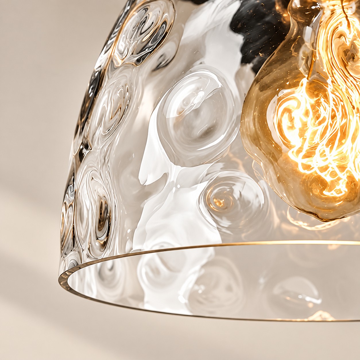 Textured Glass Wall Sconce with a clear shade and a curved arm