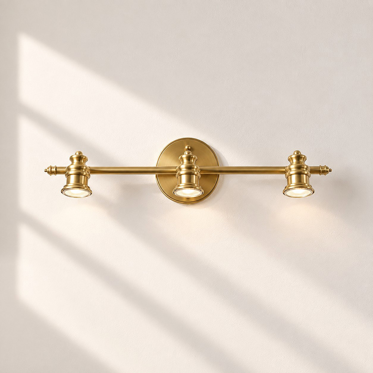 Aurelia Brass Vanity Wall Light with one to five heads and natural brass