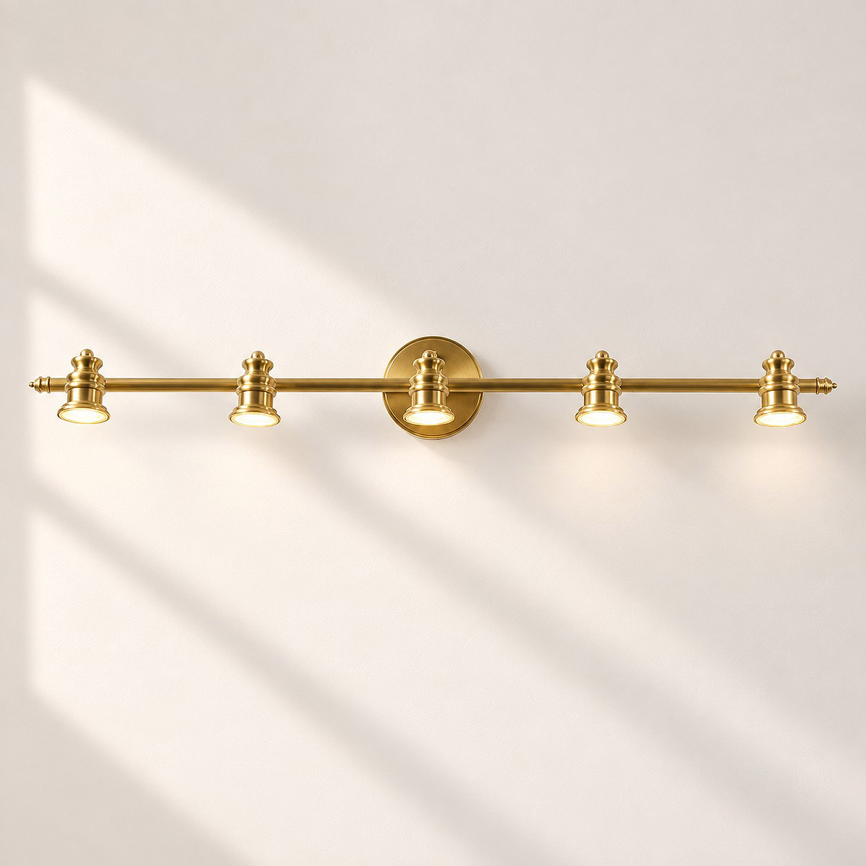 Aurelia Brass Vanity Wall Light with one to five heads and natural brass