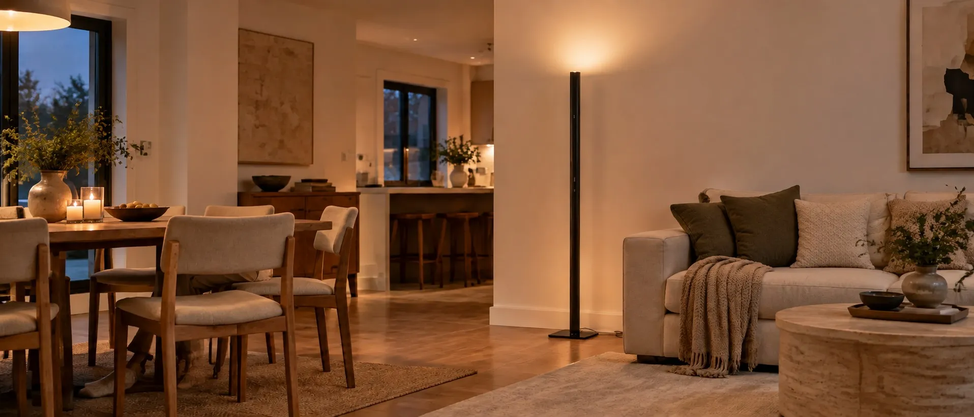 Floor lamp lighting an open living and dining room