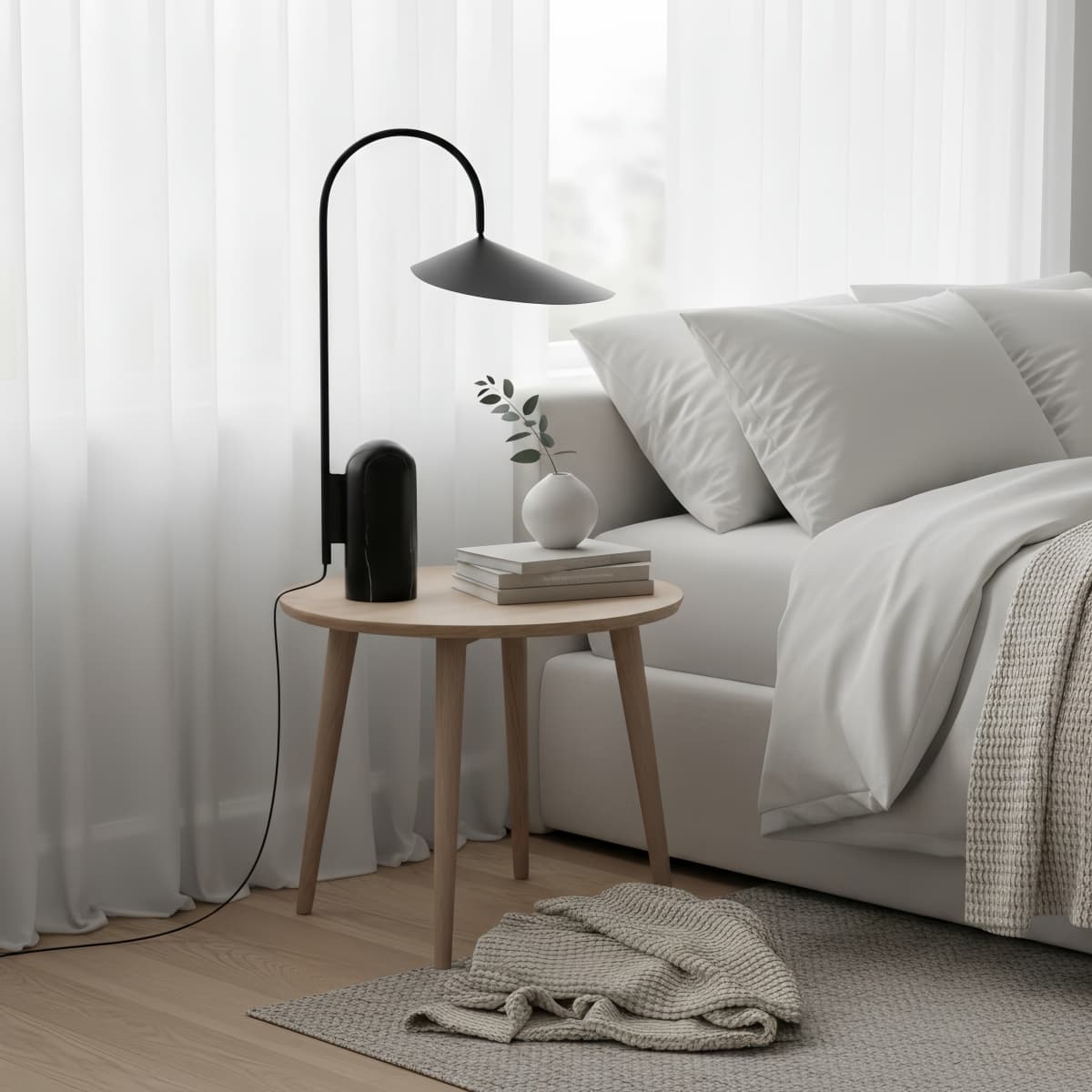Complete Black Nulavo sculptural lamp in a bedroom setting
