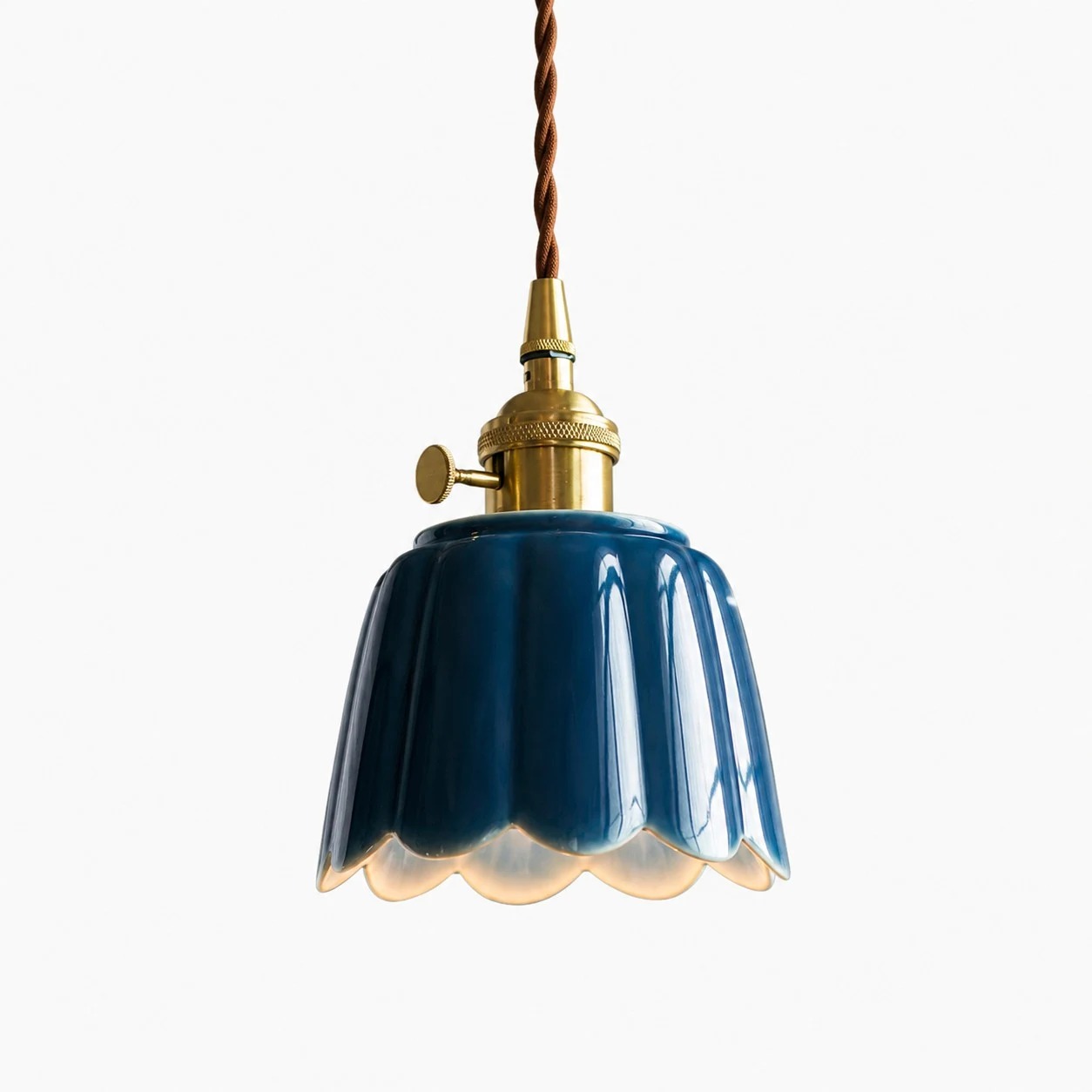 Celadon glaze ceramic lotus pendant light on clean background