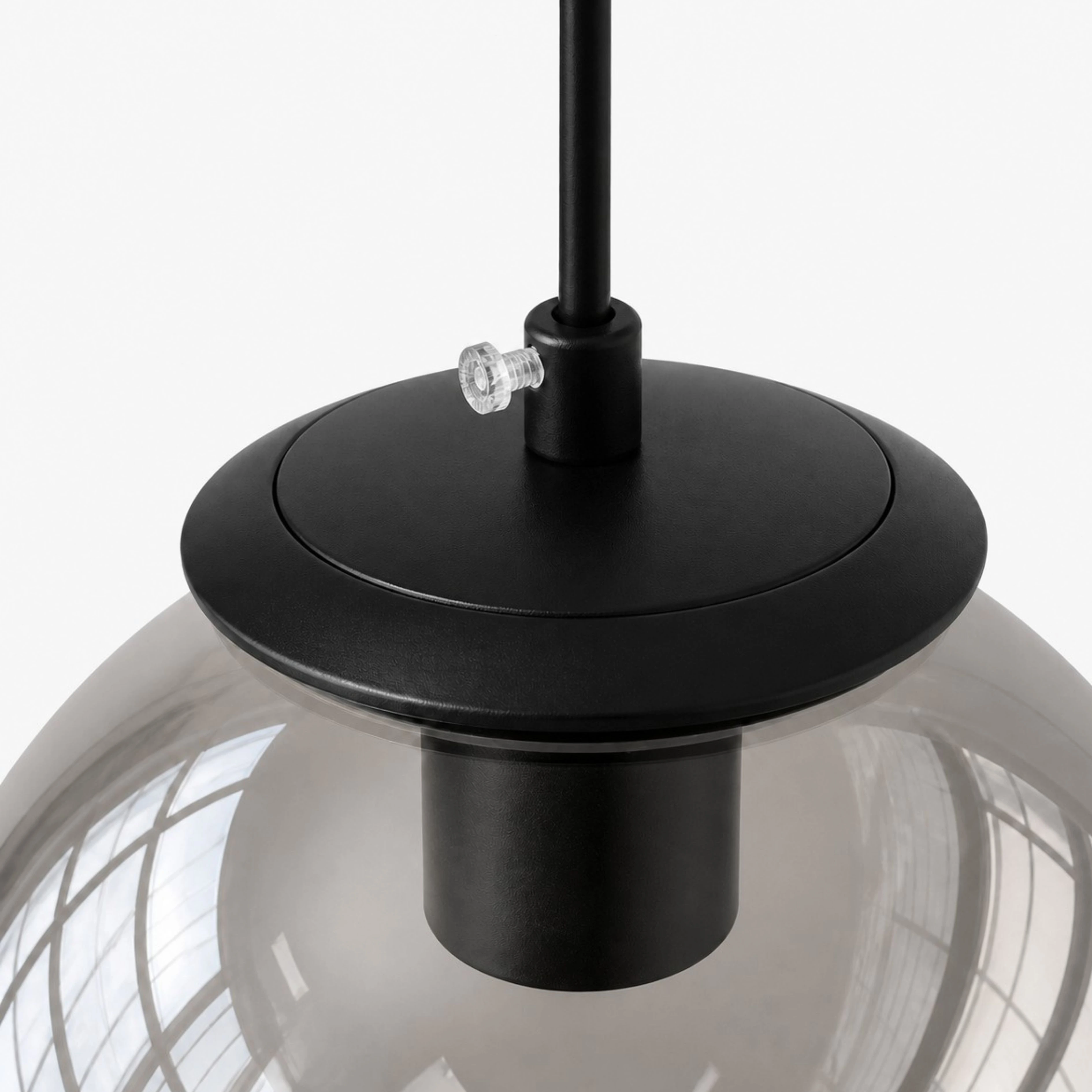 Black metal cap and glass shade connection detail