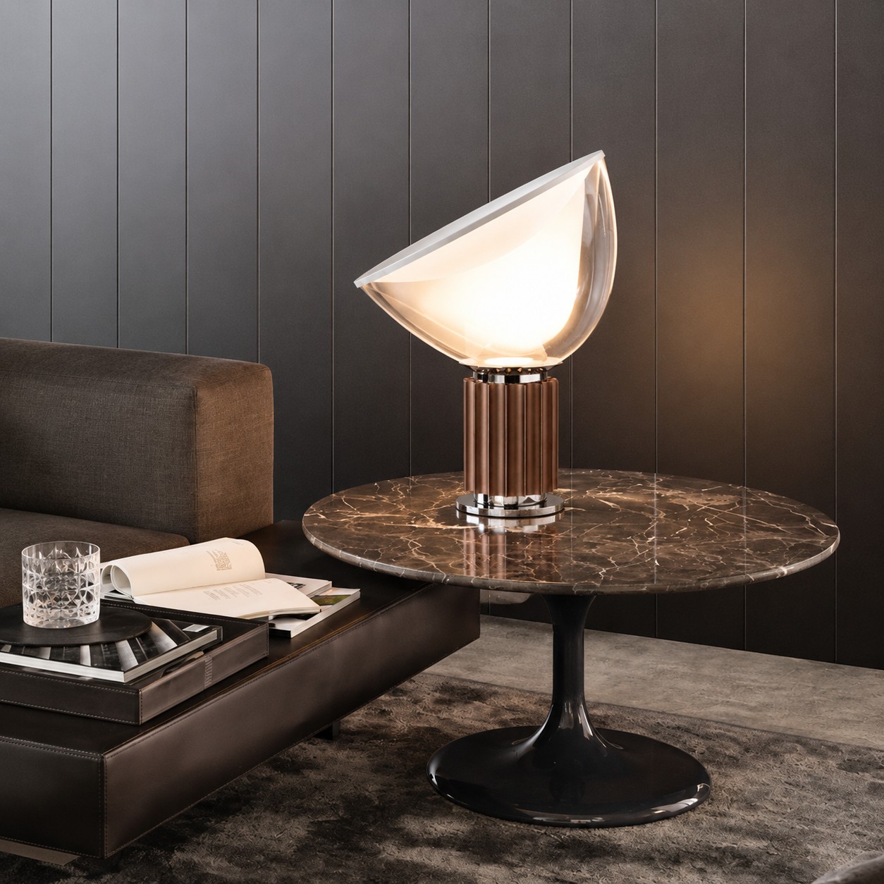 Bronze Taccia lamp on a dark marble lounge table