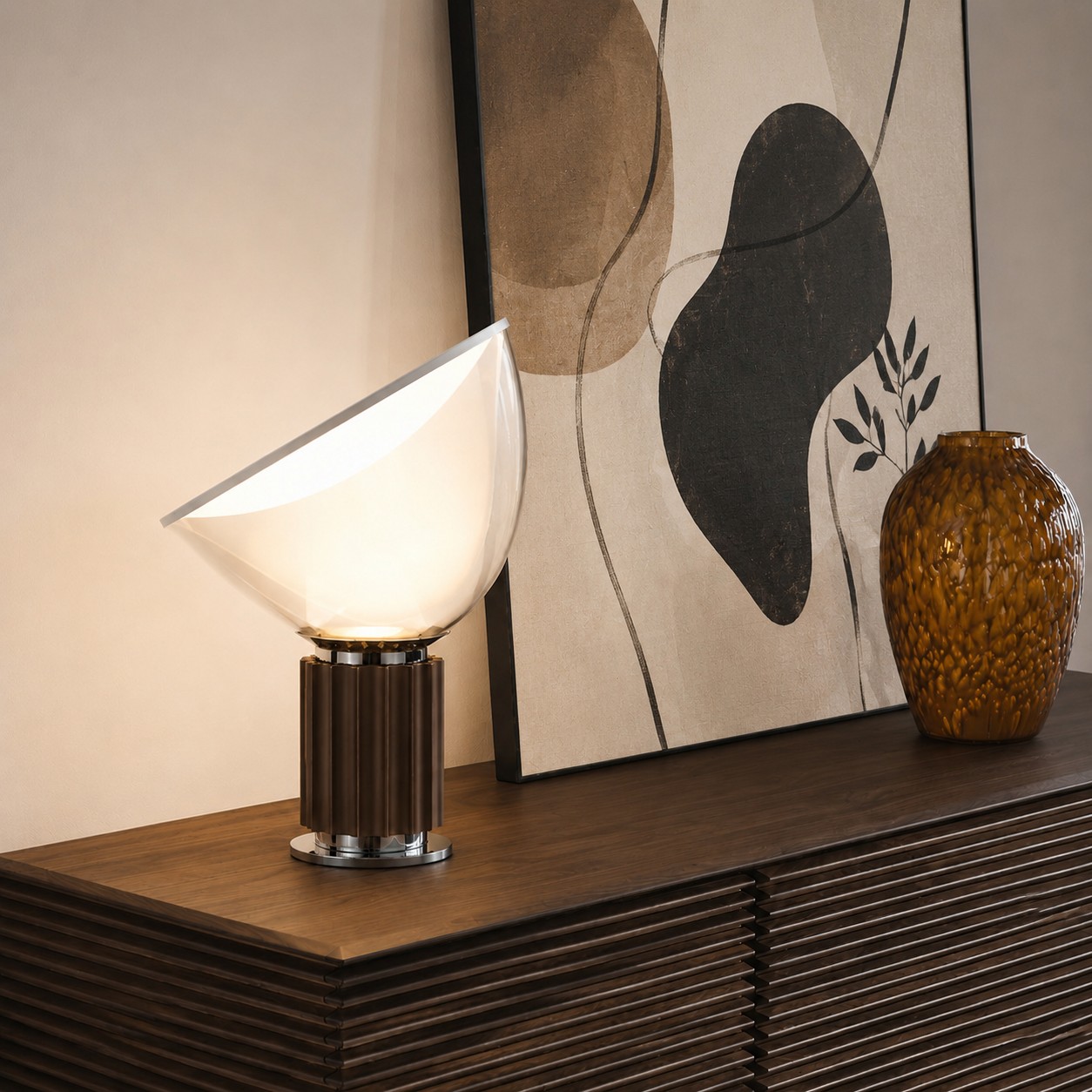 Bronze Taccia lamp beside abstract artwork