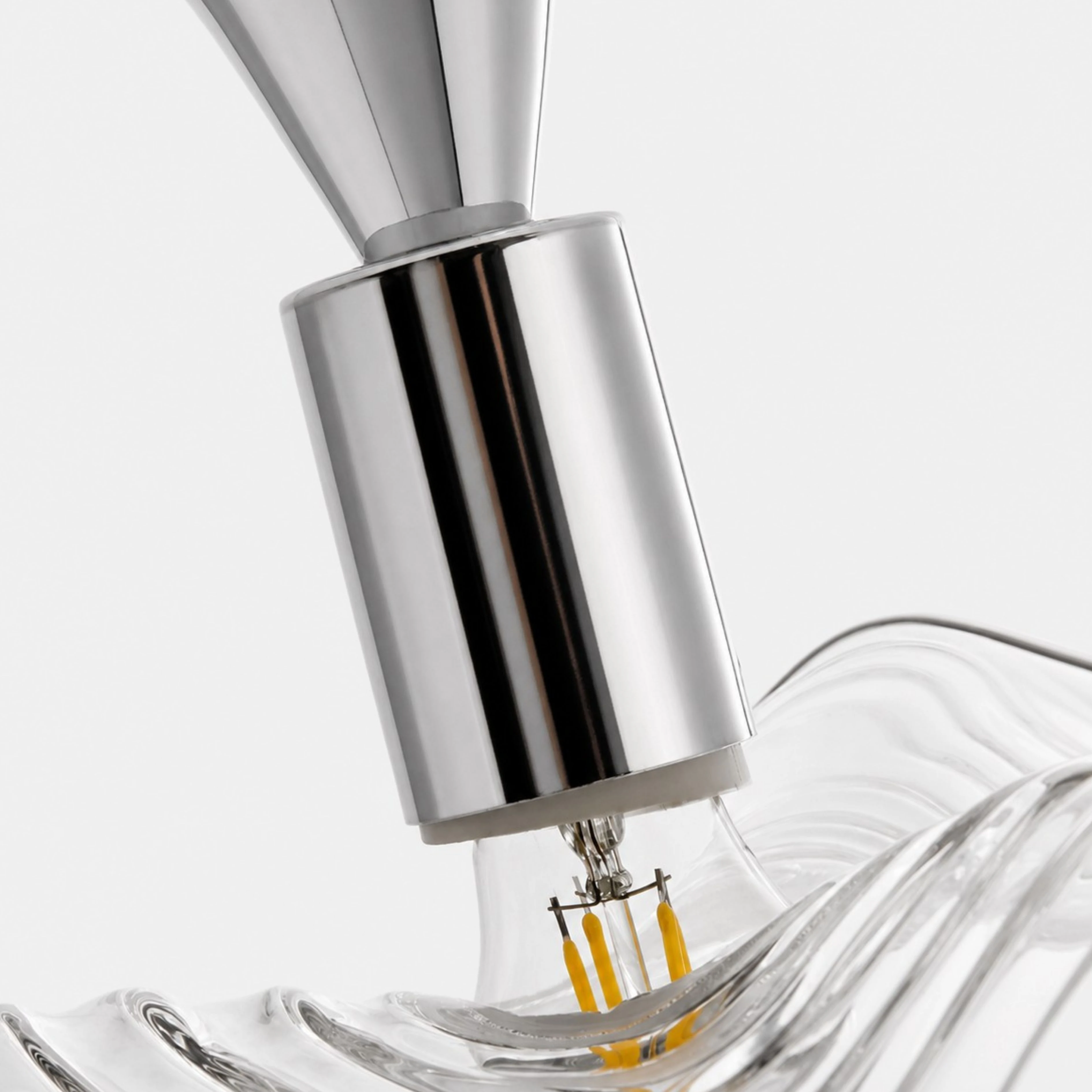Close view of the Chrome lamp holder and glass edge