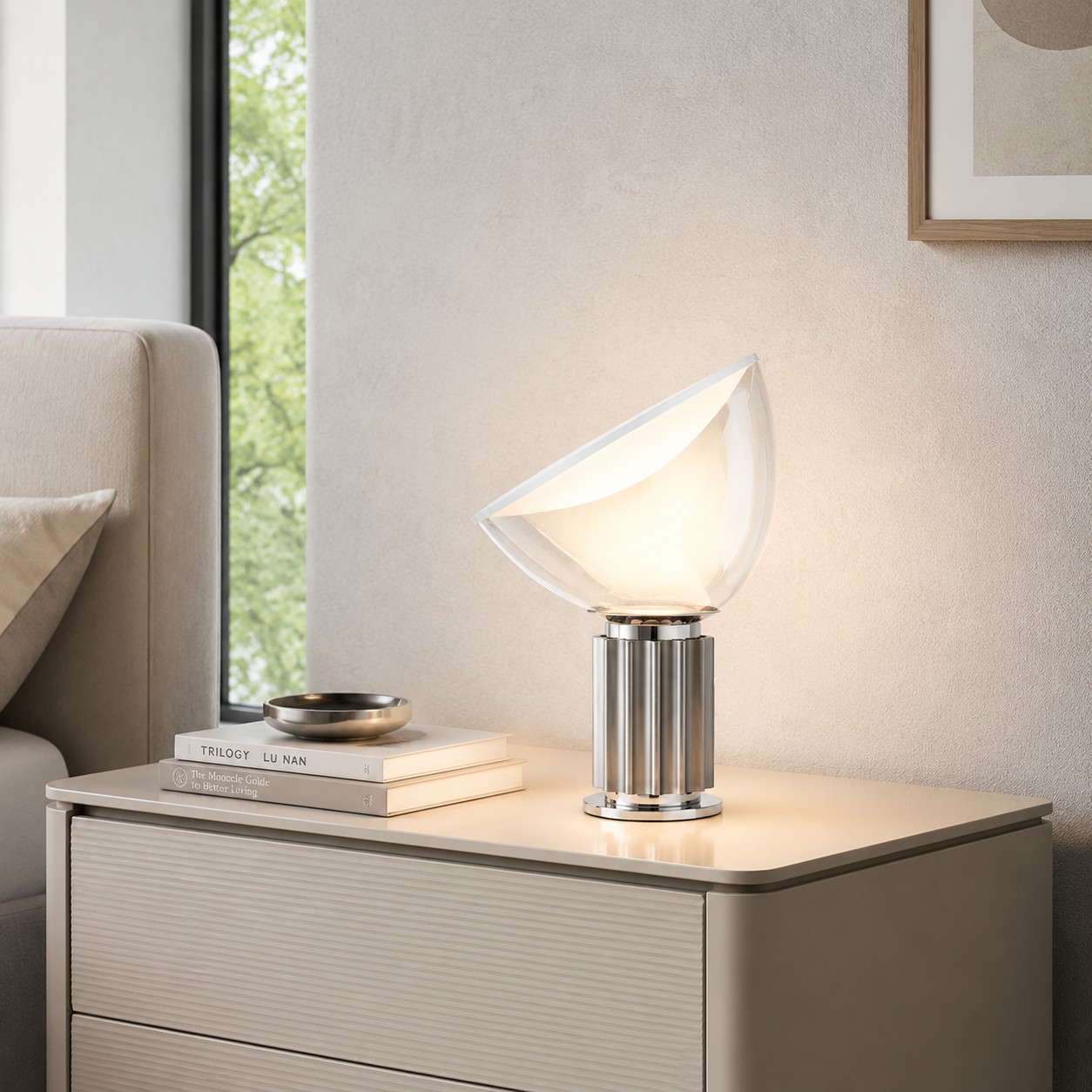 Silver Taccia lamp on a warm bedside cabinet