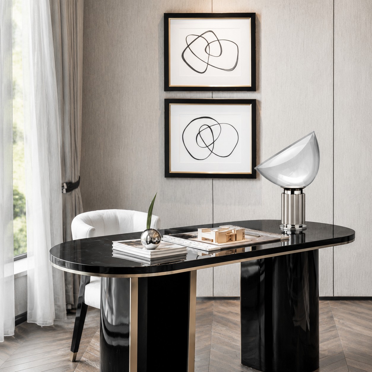 Silver Taccia lamp on a black console table