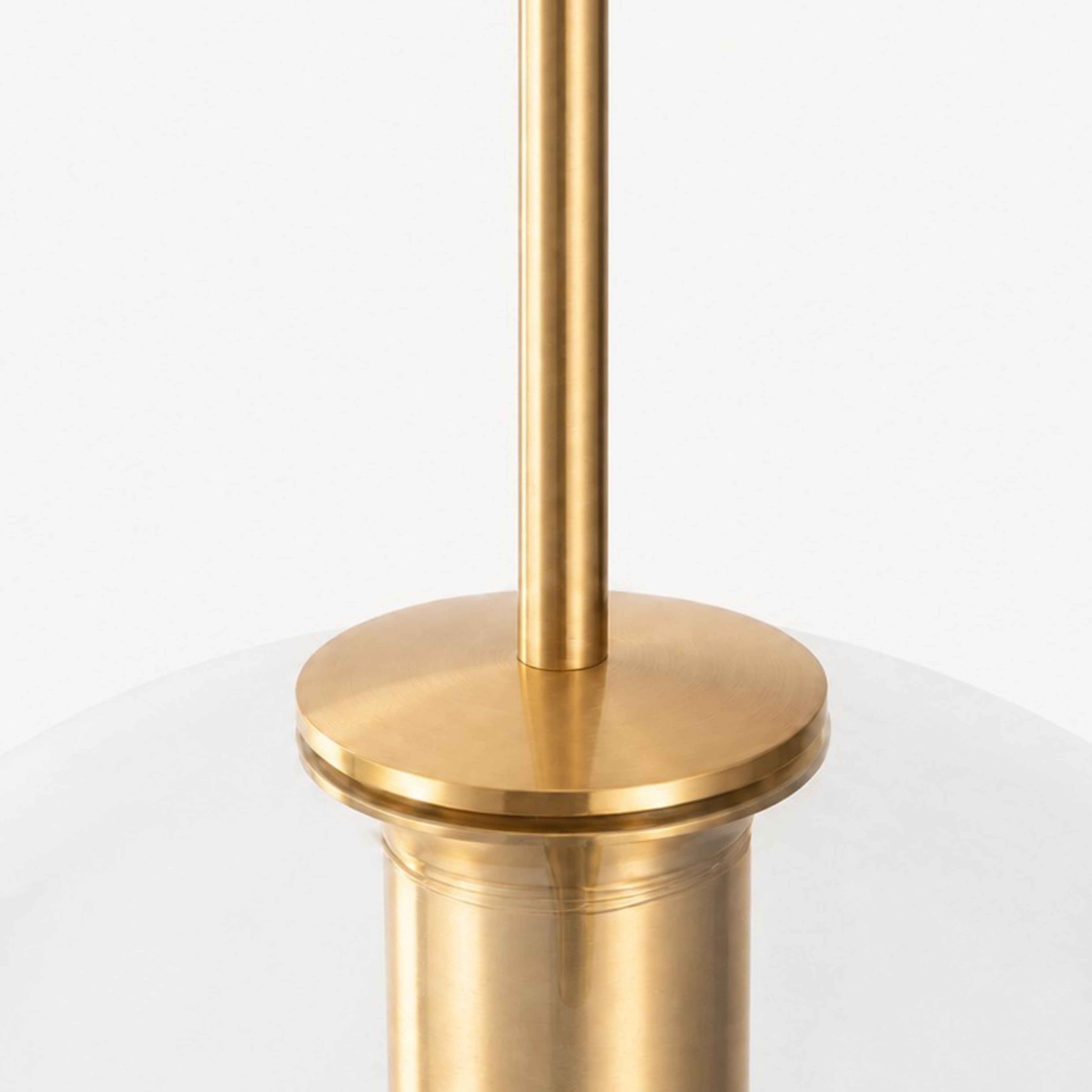 Brass stem and glass cap detail on Luma pendant light