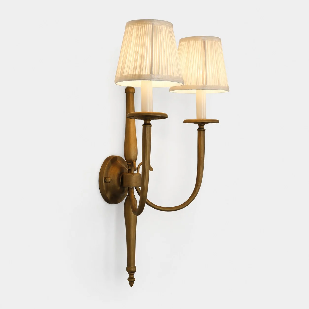 Antique brass double wall sconce with cream pleated shades