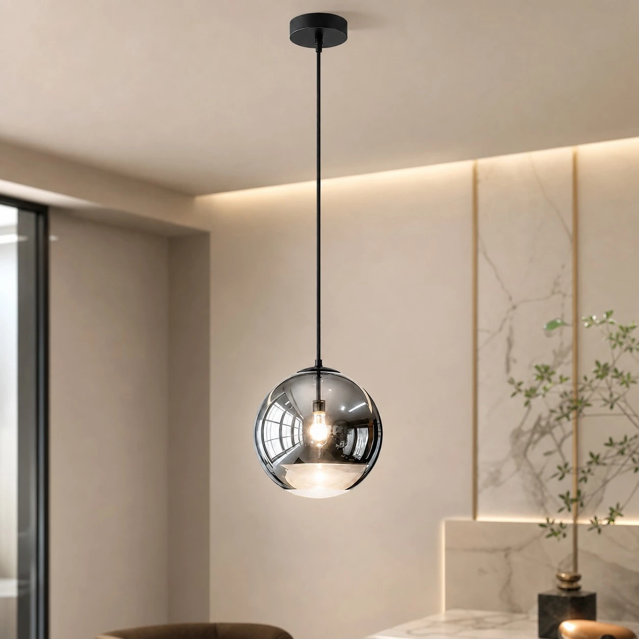 Style A Luma mirrored globe pendant in a warm modern interior