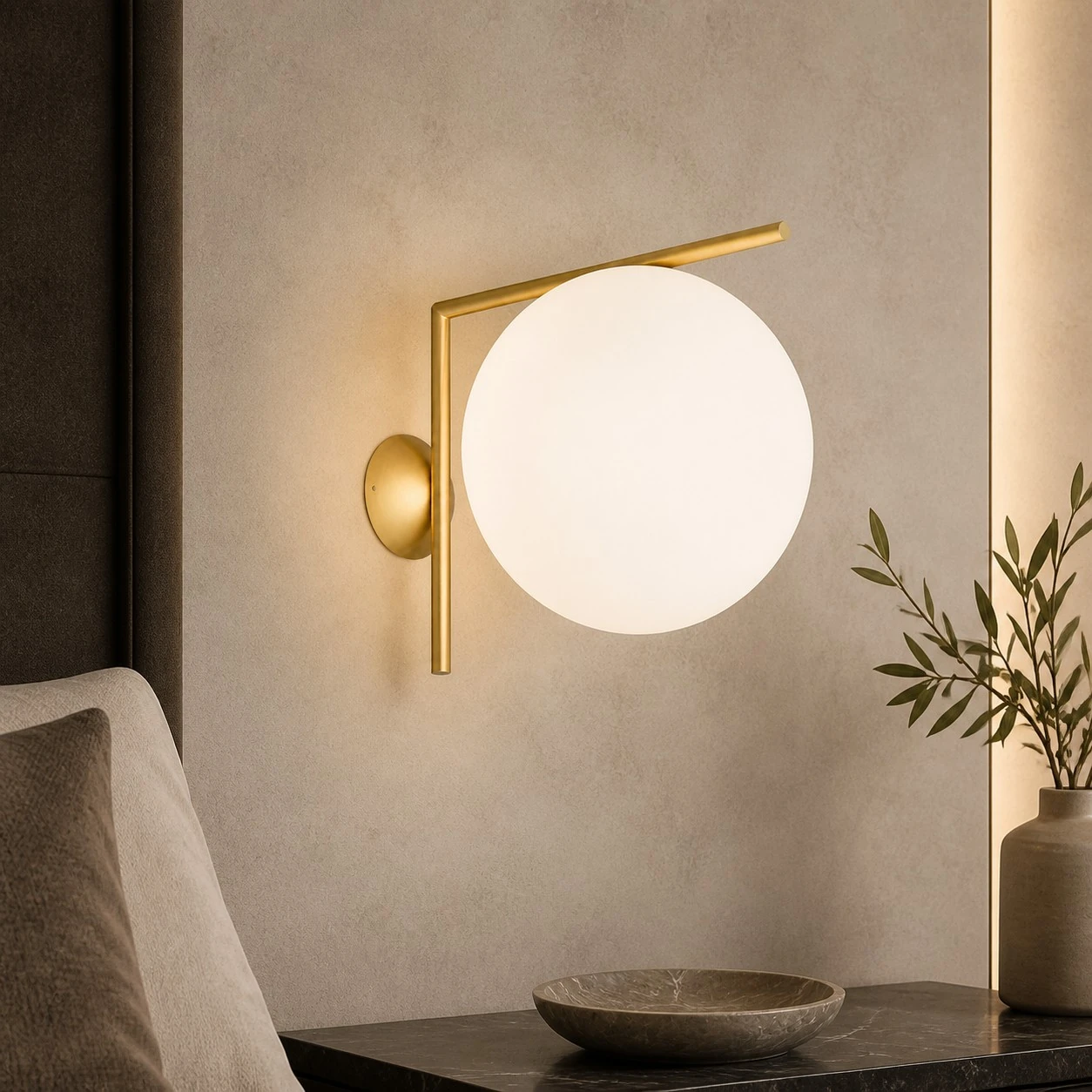 Gold offset globe wall sconce in a neutral lounge
