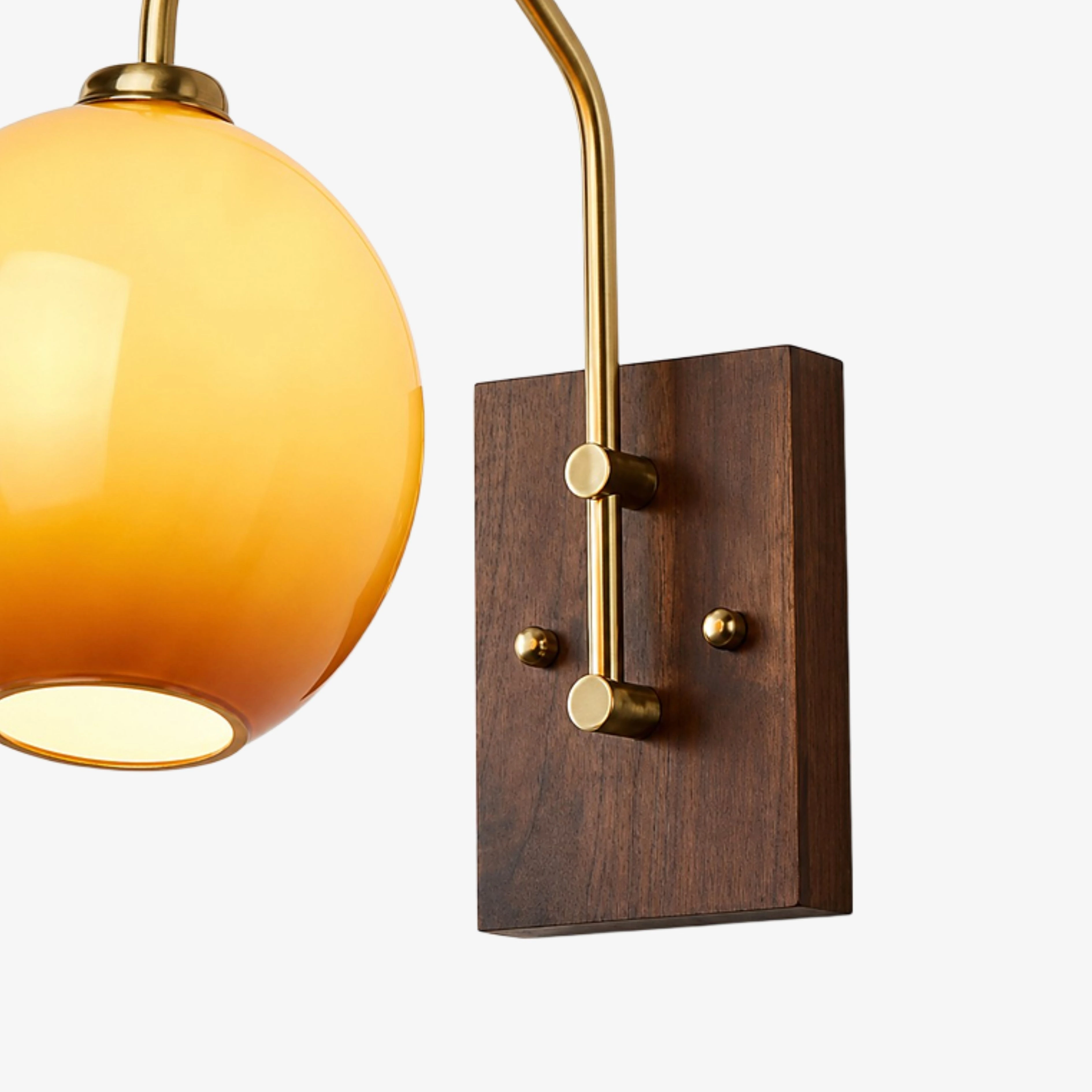 Brass-toned metal and walnut wood frame detail