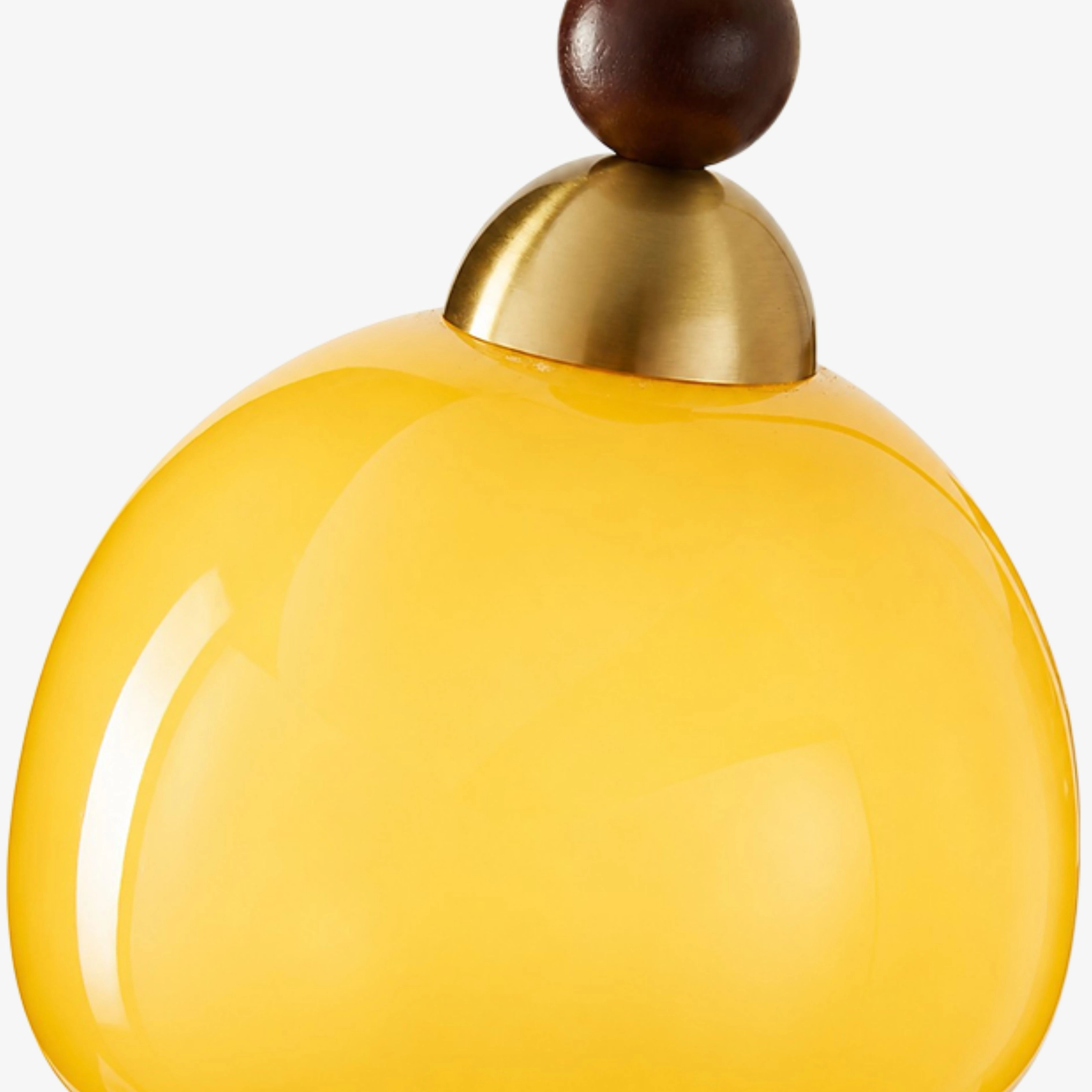 Brass-toned cap and fixture connection detail