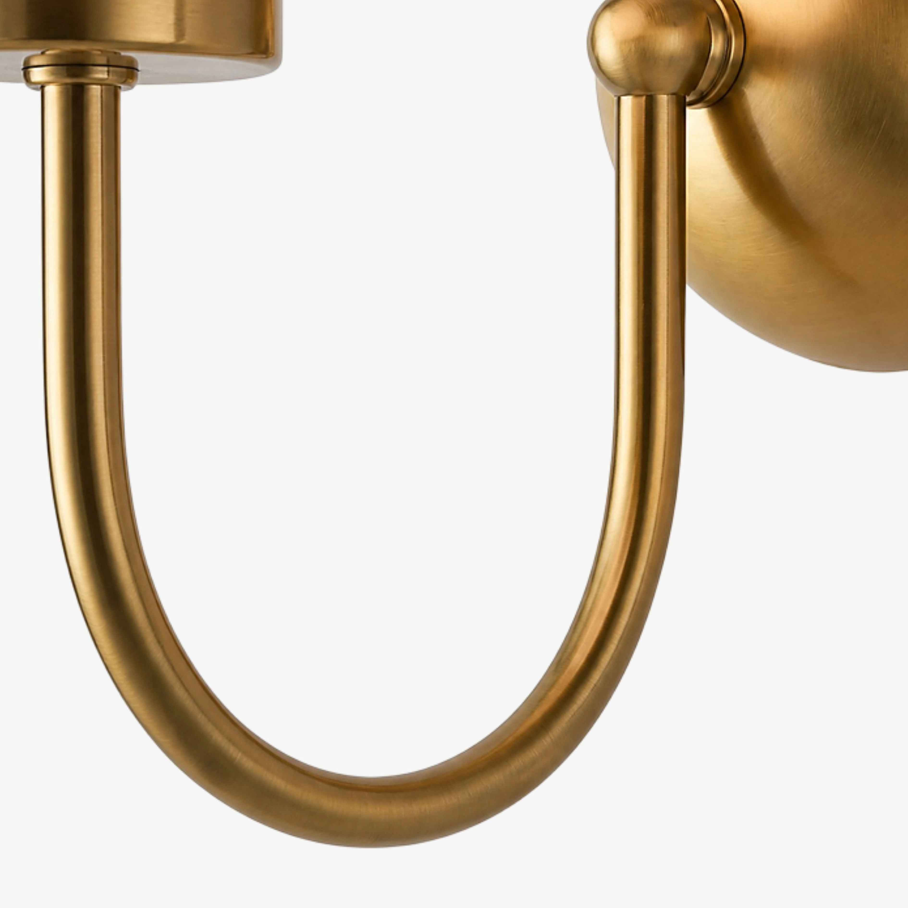 Natural Brass curved arm and wall plate detail