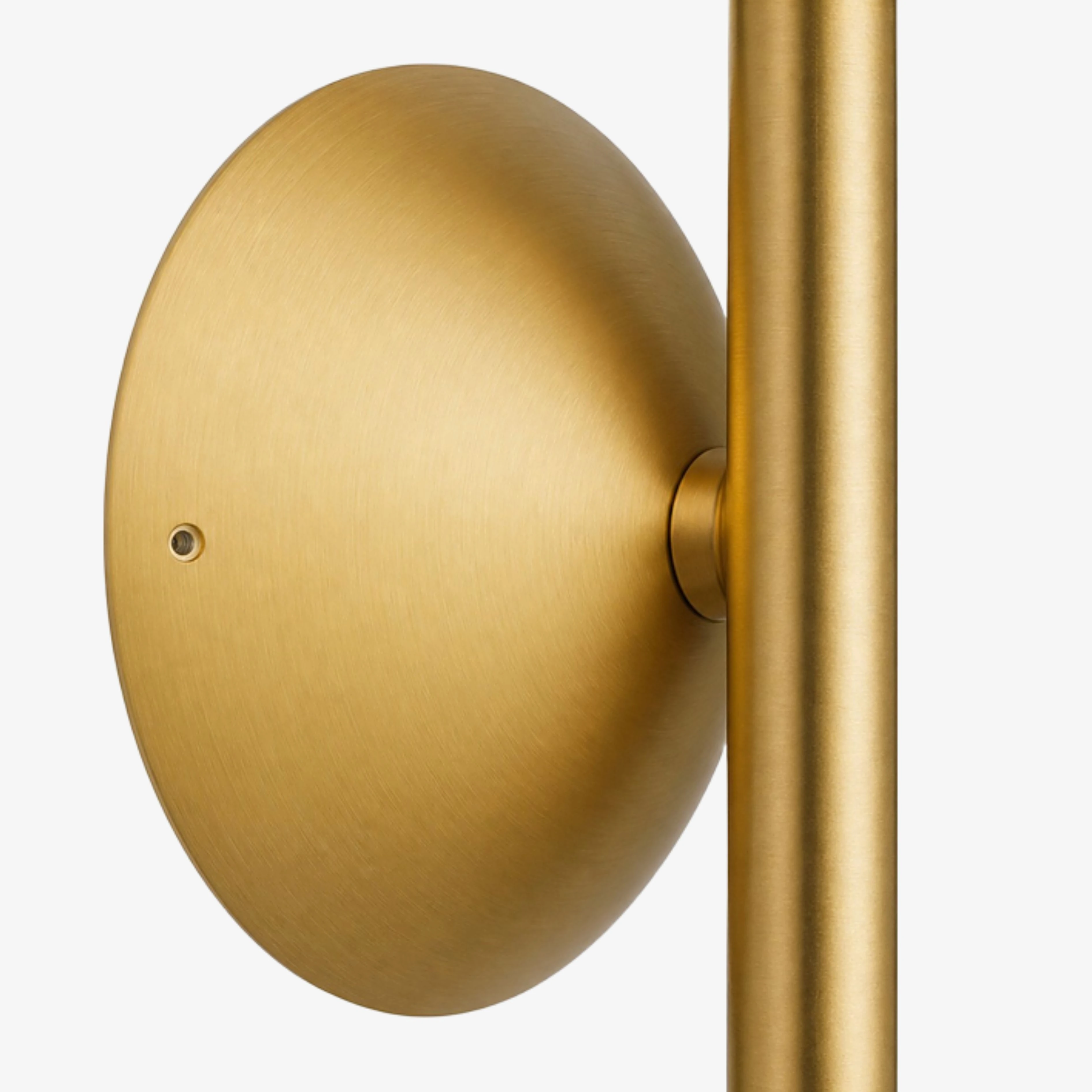 Close view of the round brushed Gold wall plate