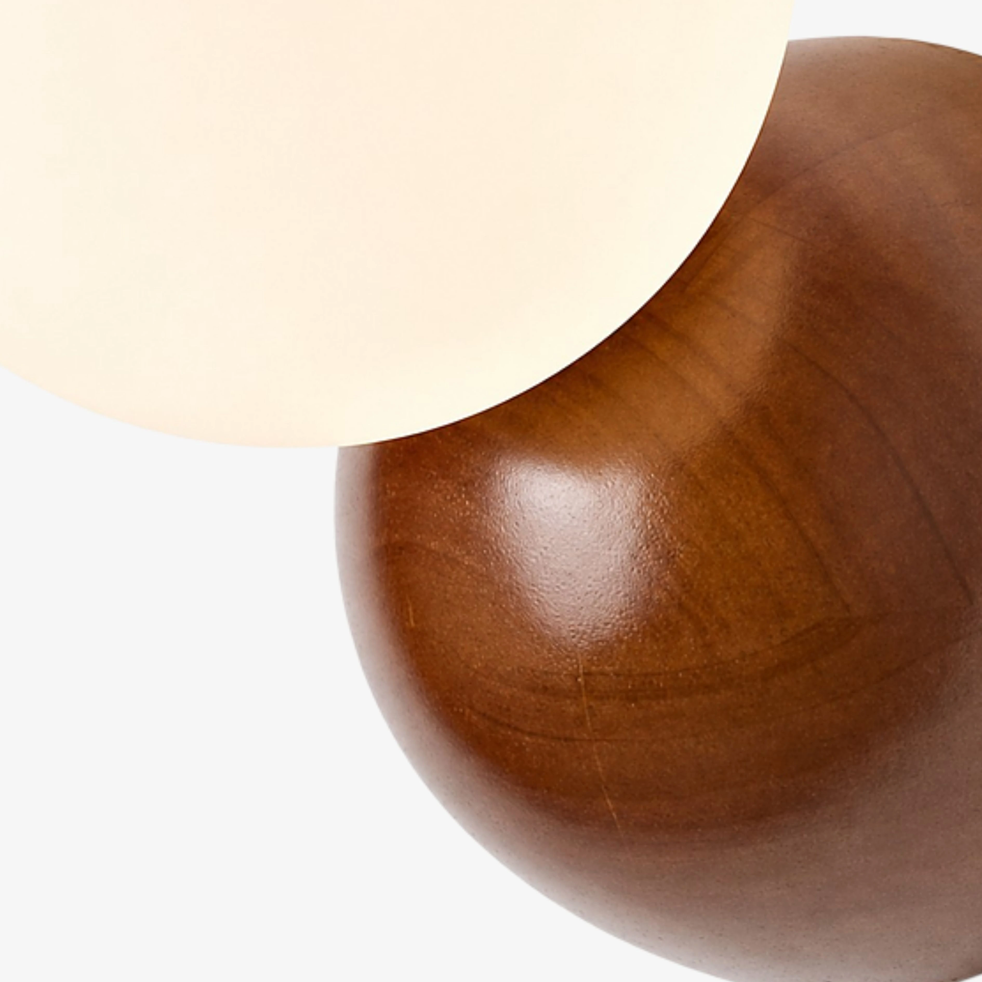 Walnut wood grain and opal globe connection detail