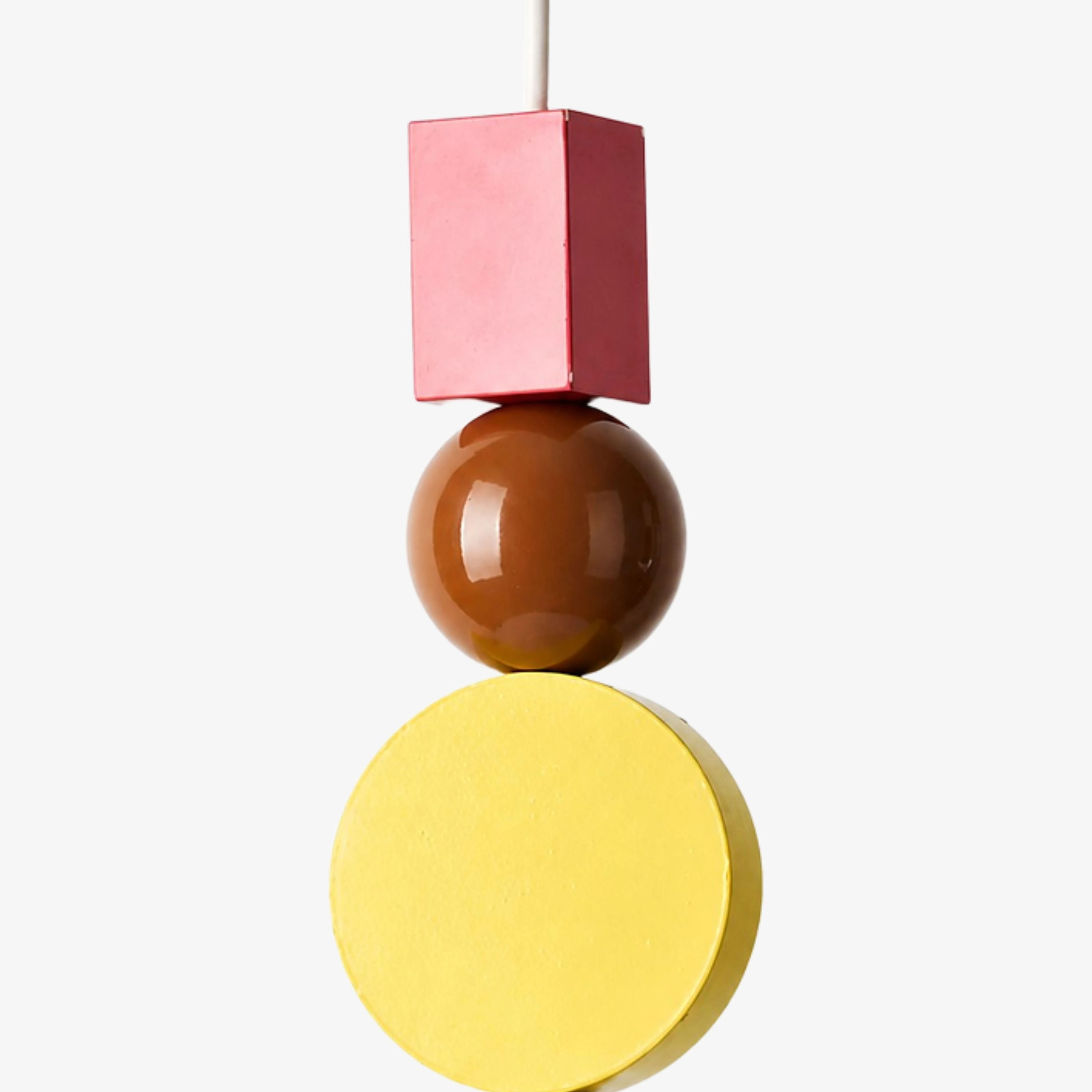 Close view of the red, amber, and yellow stacked ornaments