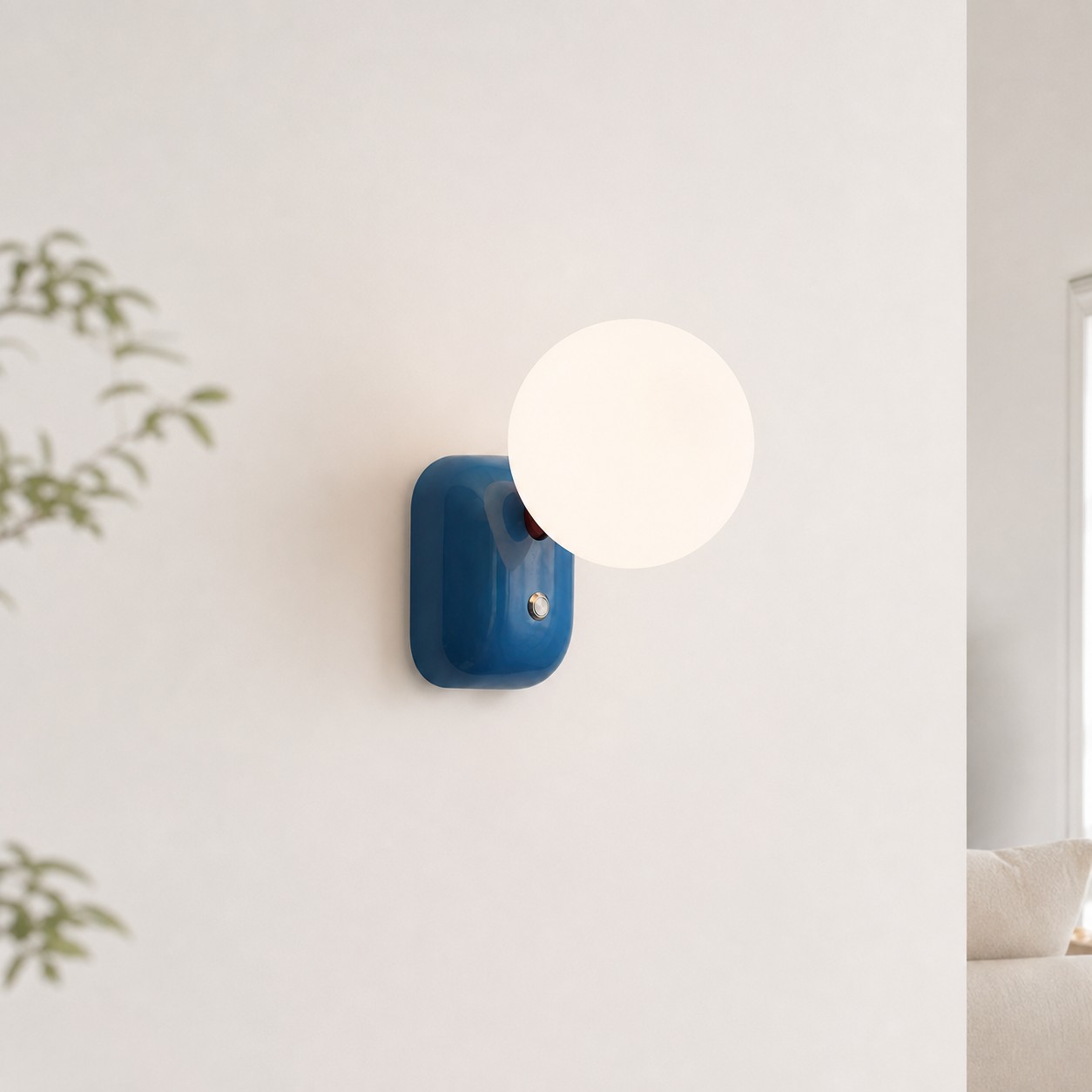 Luma Blue compact globe wall sconce in a minimal interior