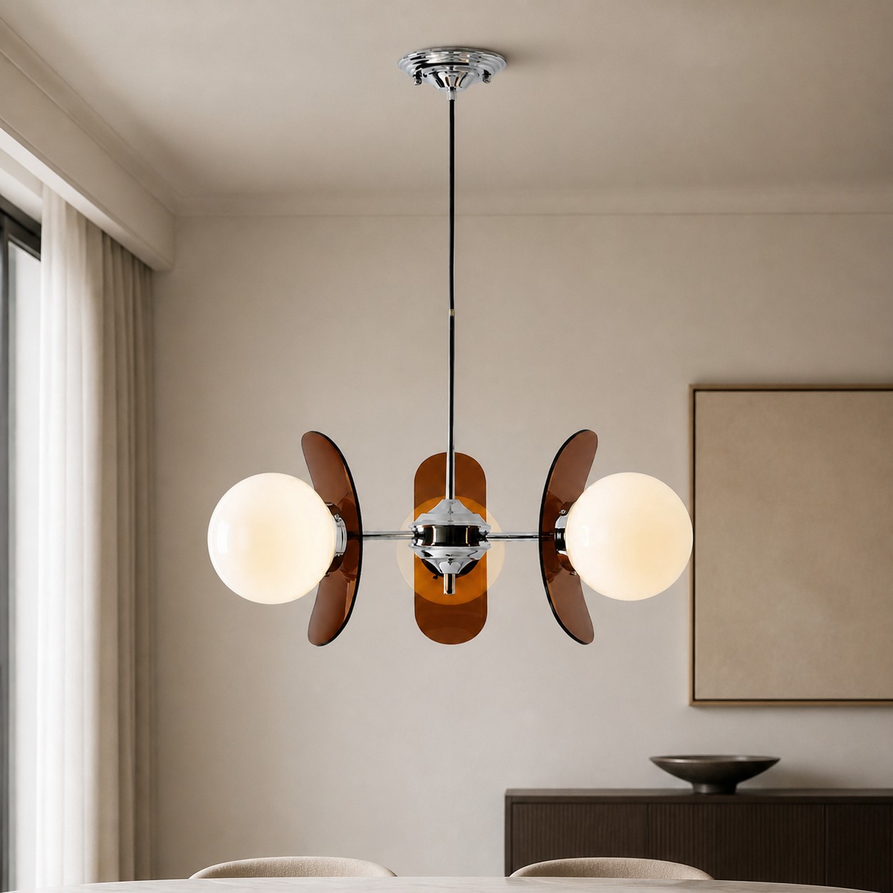 Three-head Amber Luma chandelier in a neutral modern room