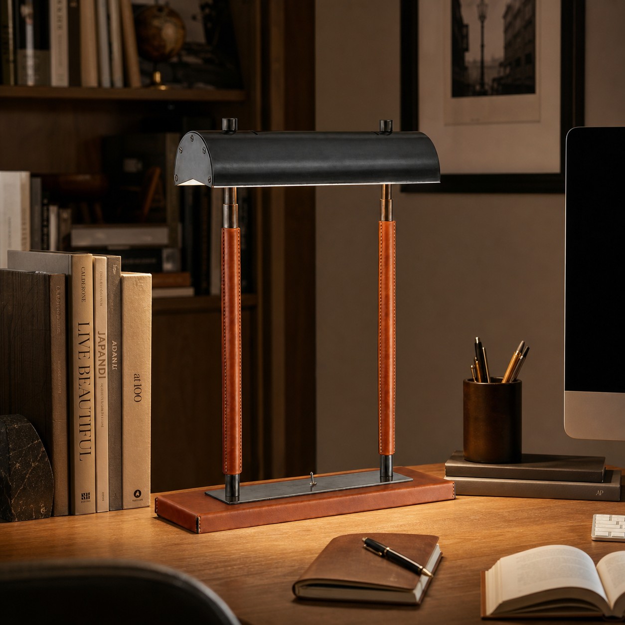 Orange leather double-column table lamp in a study