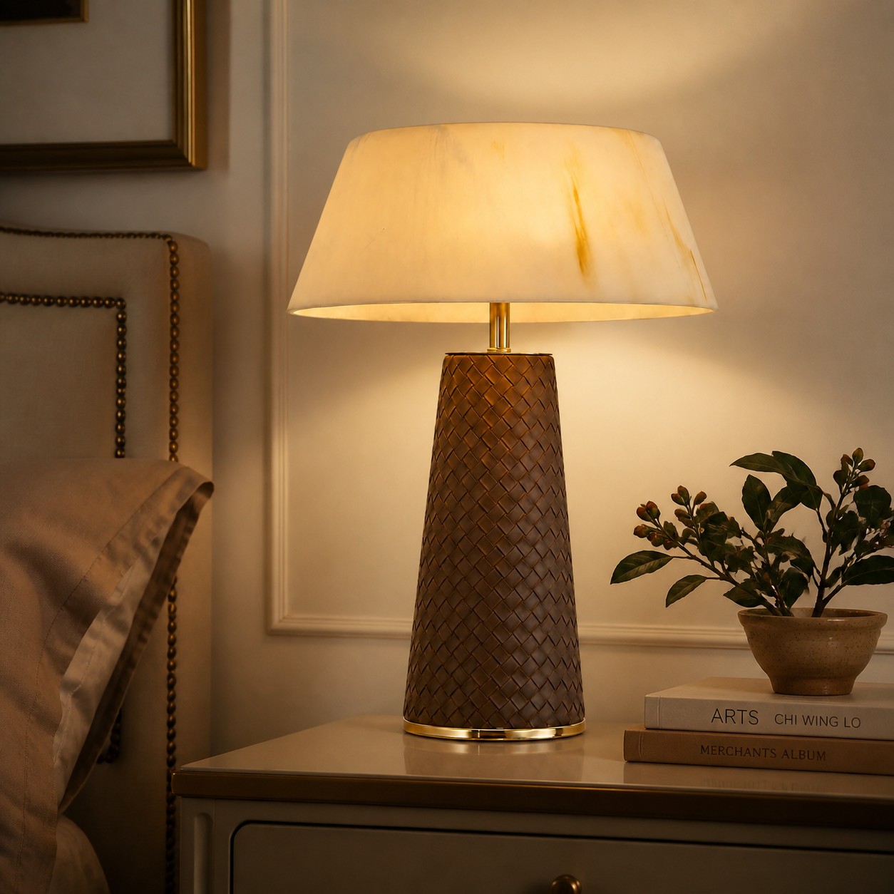 Leather table lamp styled beside an upholstered bed