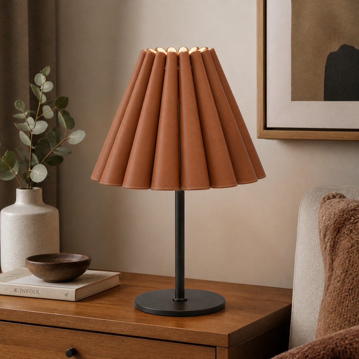 Caramel brown leather table lamp on a wood side table