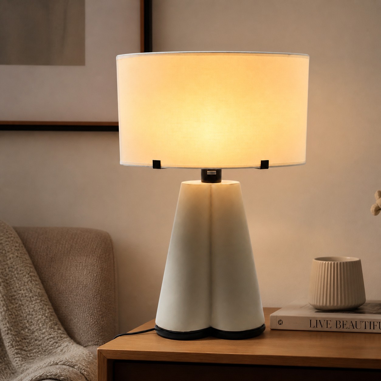 Beige leather table lamp glowing in a warm living room