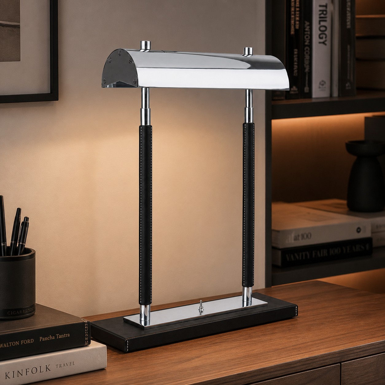 Black leather double-column table lamp on a desk