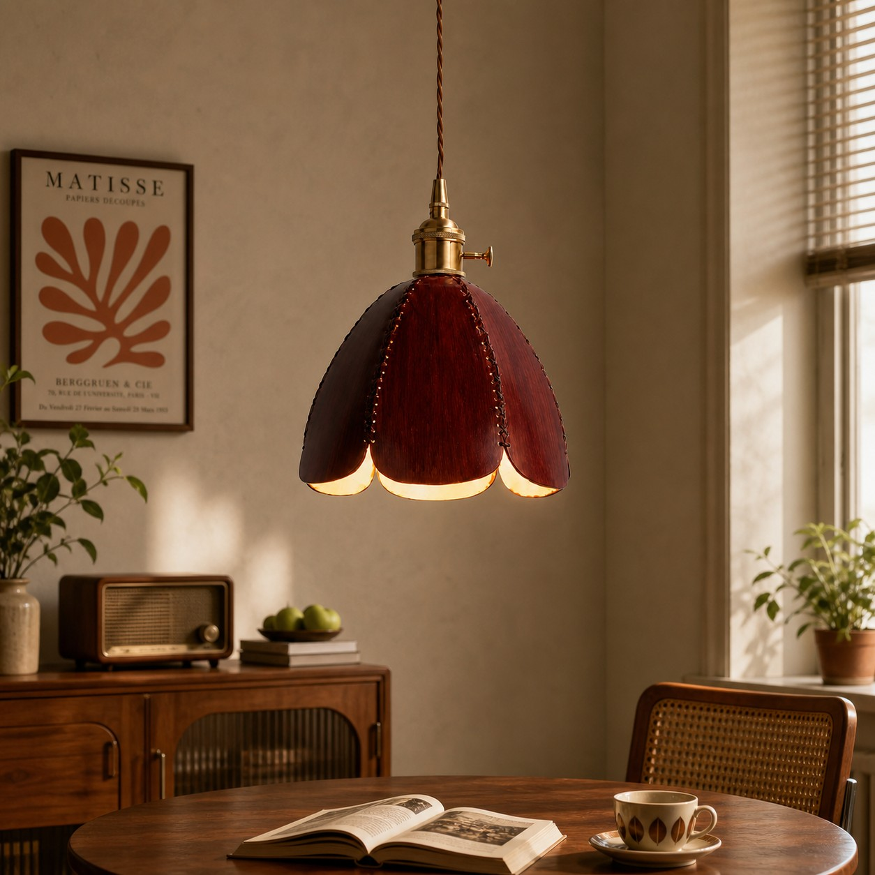 Brown leather petal pendant lamp above a dining table