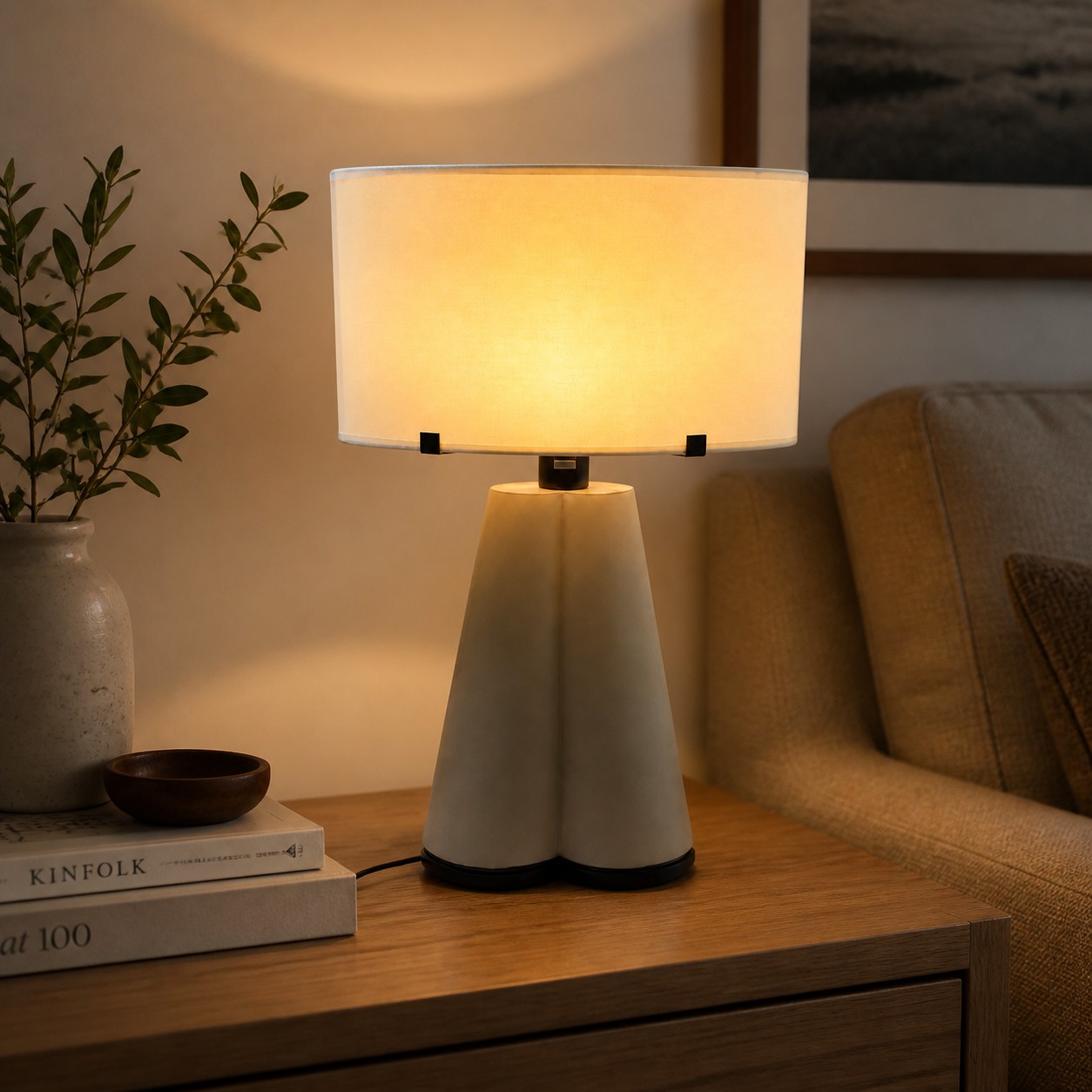 Beige leather table lamp styled on a wood sideboard