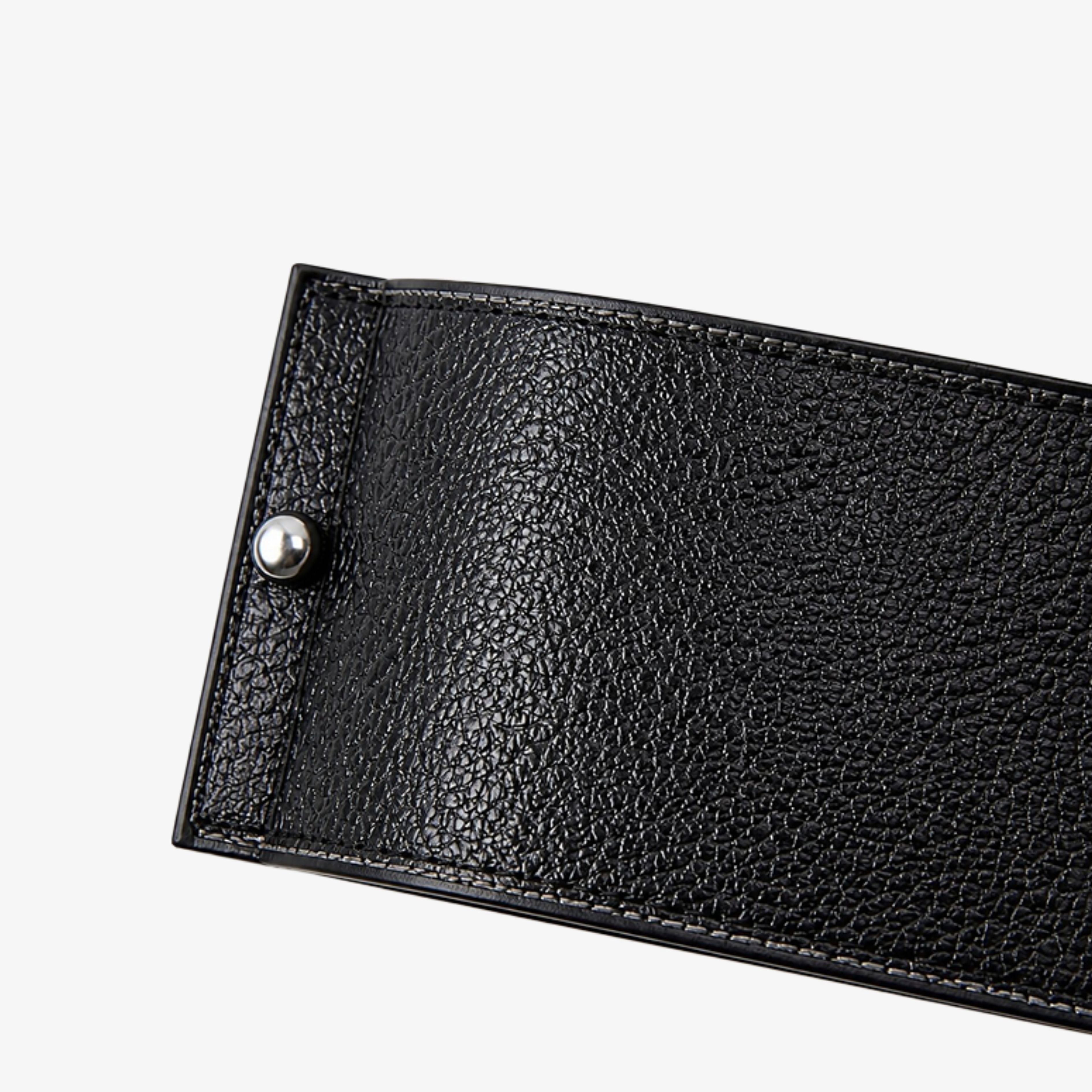 Black textured leather and polished metal fastener