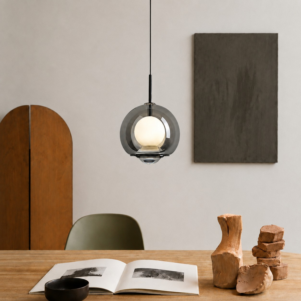 Smoked double-globe pendant above a dining table