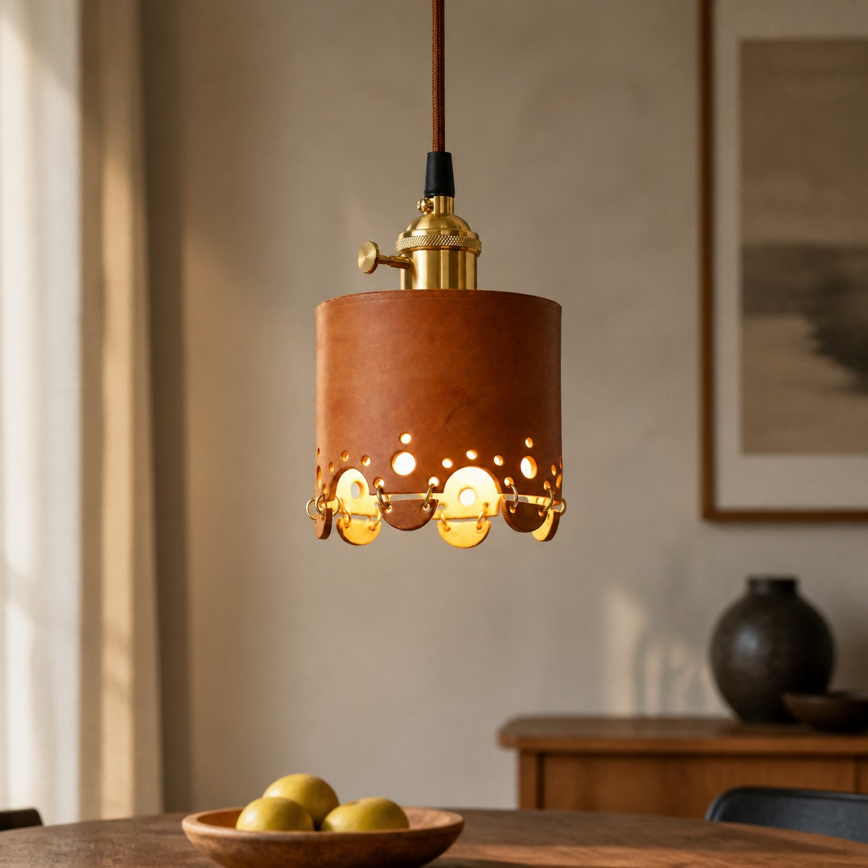 Scalloped-disc leather pendant above a table