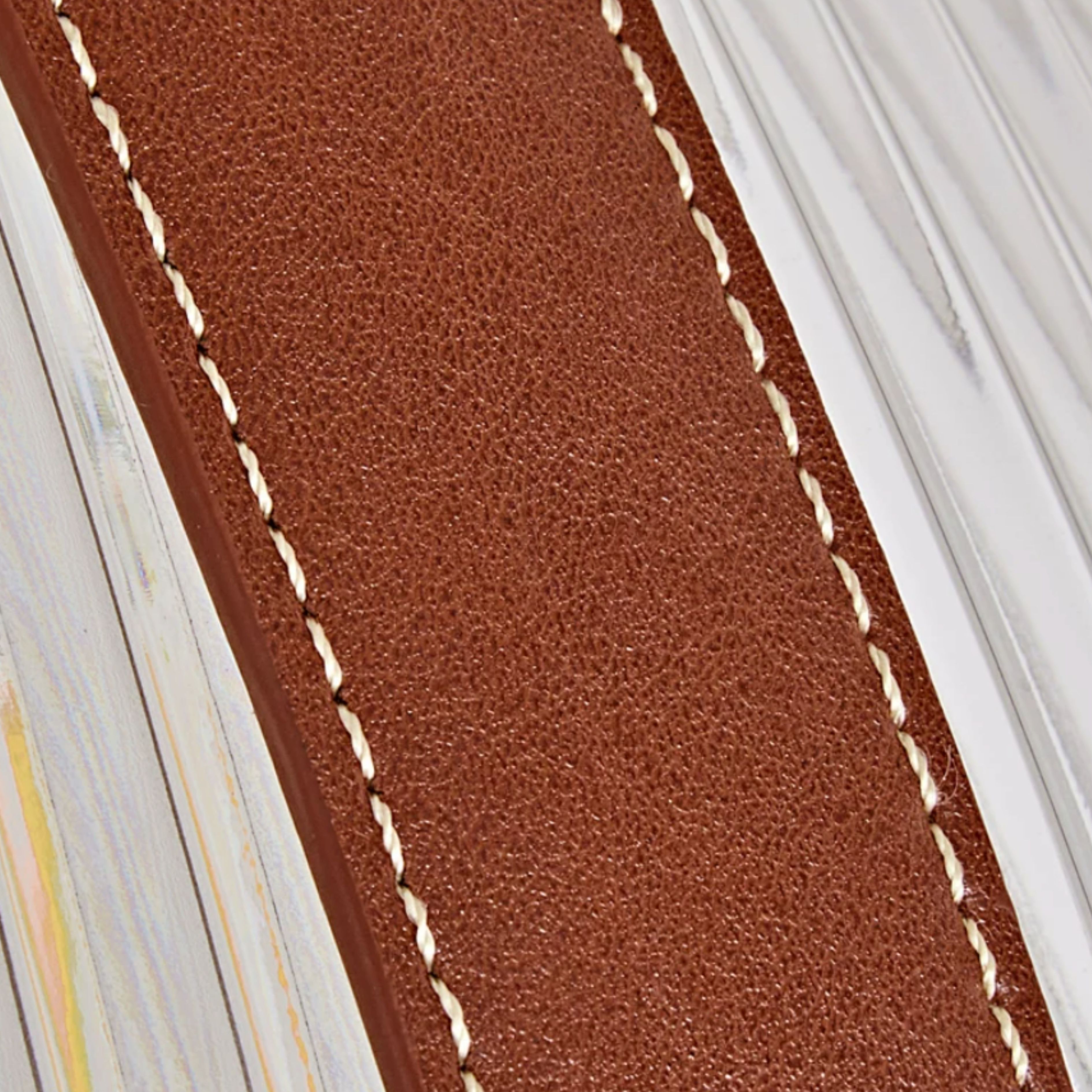 Brown leather texture with contrast stitching