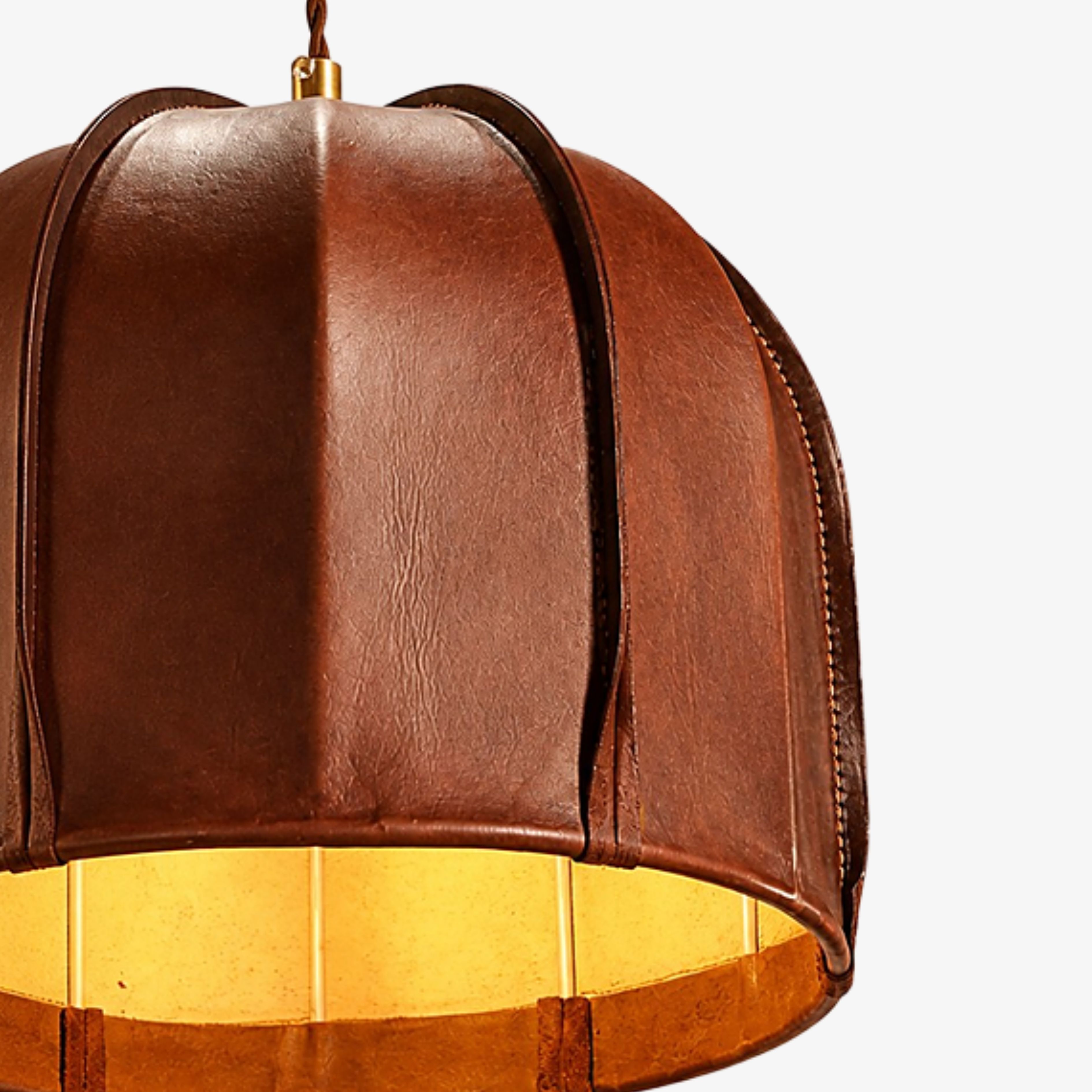 Close view of dark brown leather grain and stitched panels