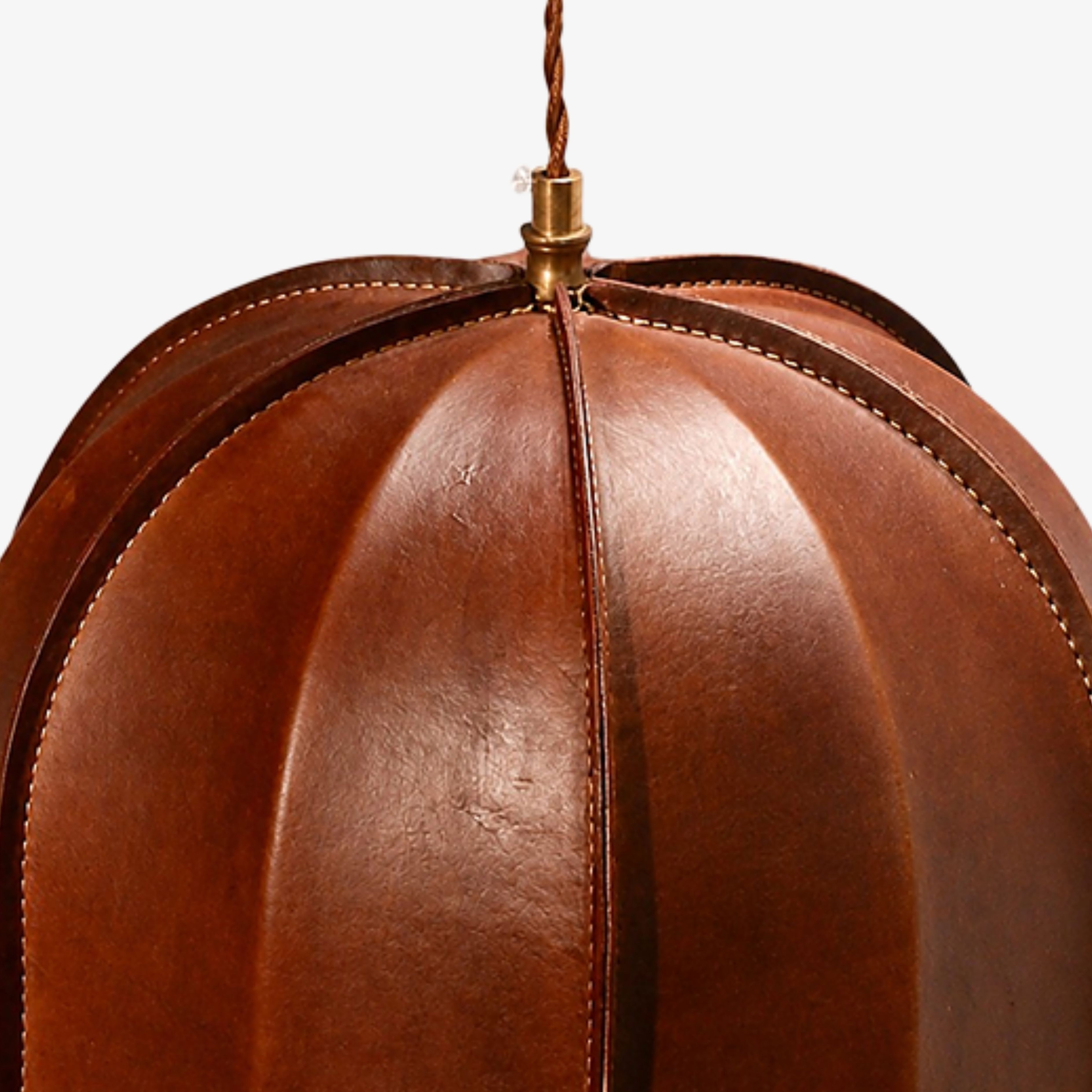 Stitched leather ribs and brass suspension hardware