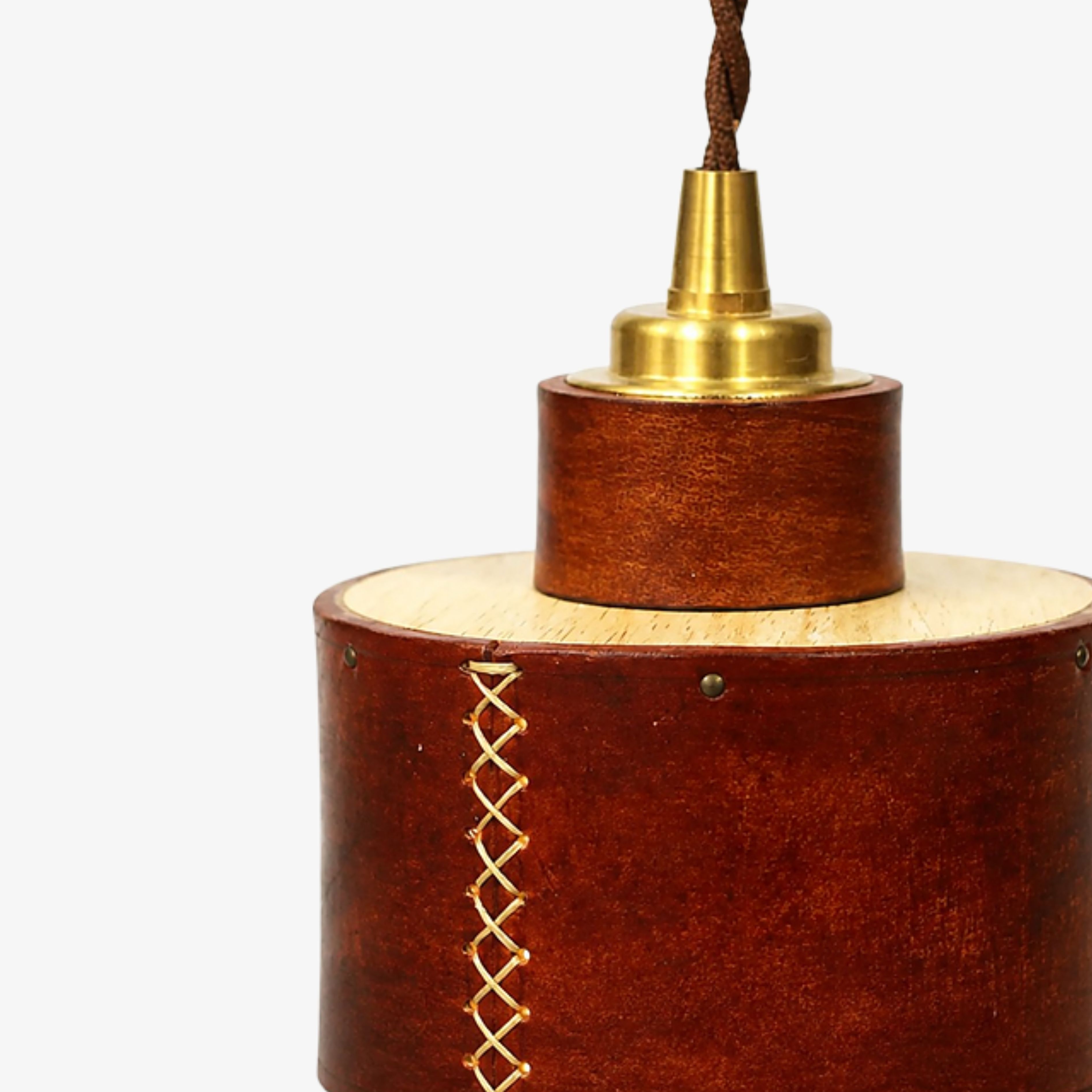 Hand-laced leather seam and brass suspension cap