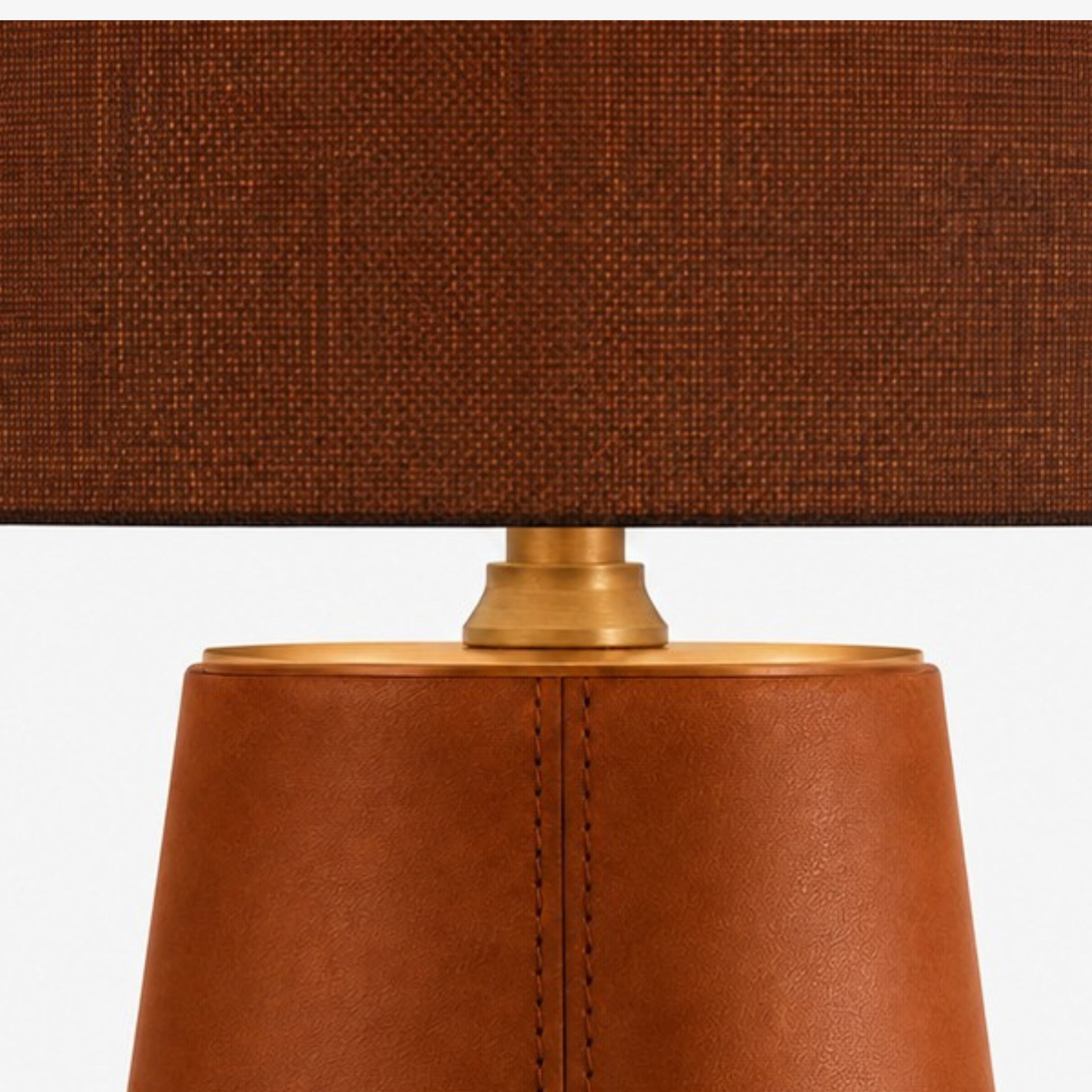 Brass neck between leather base and brown shade