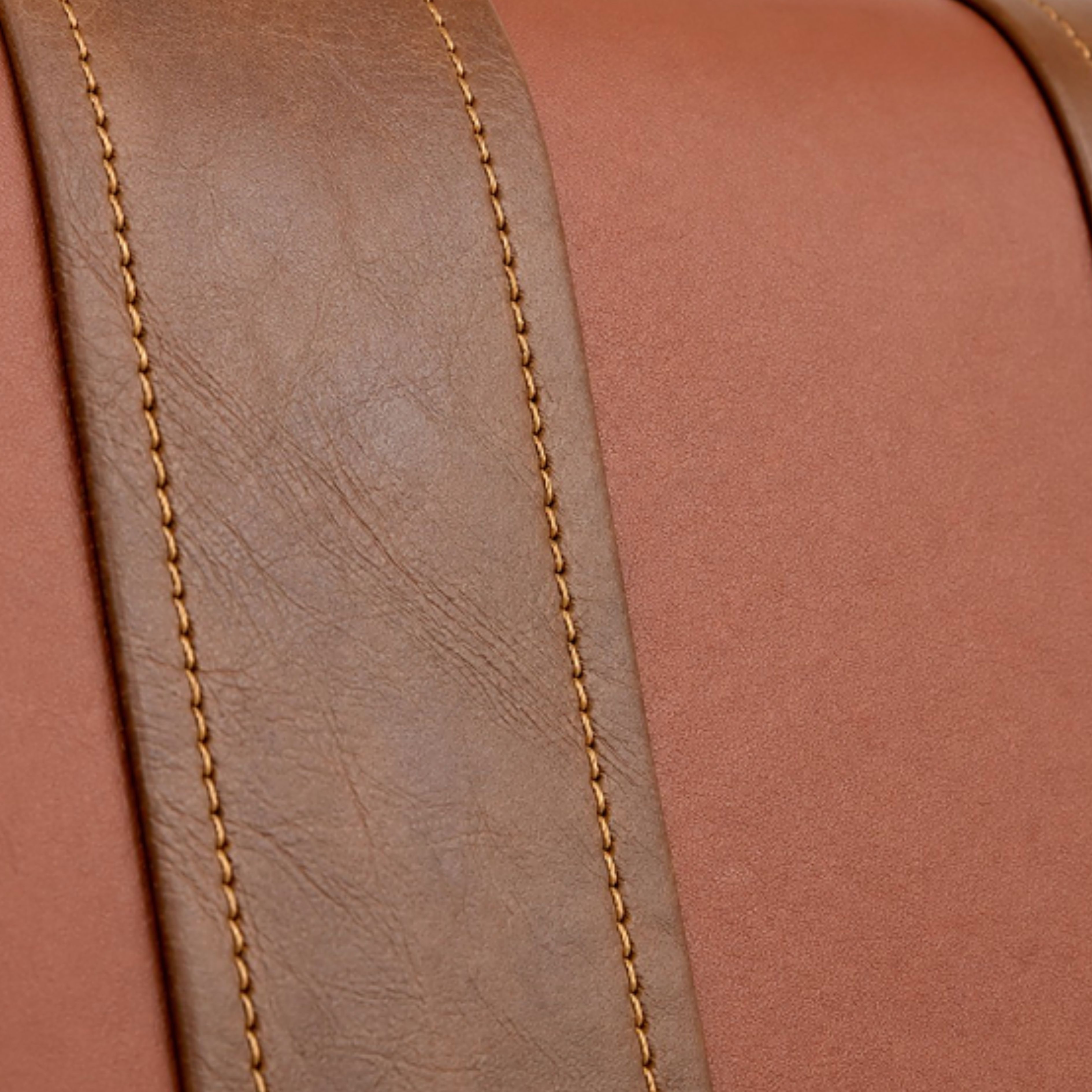 Close view of layered stitched leather panels