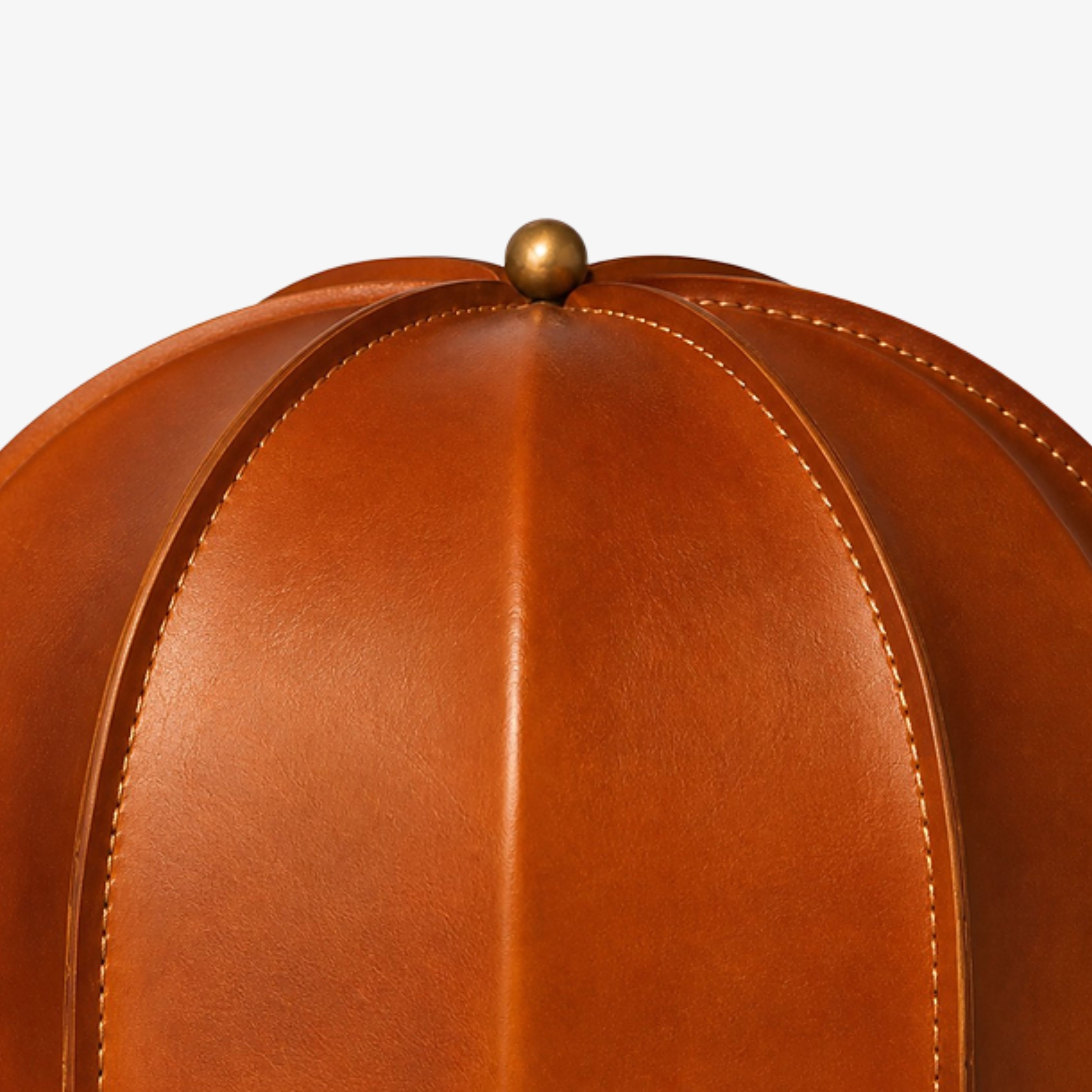 Close view of stitched caramel leather shade panels