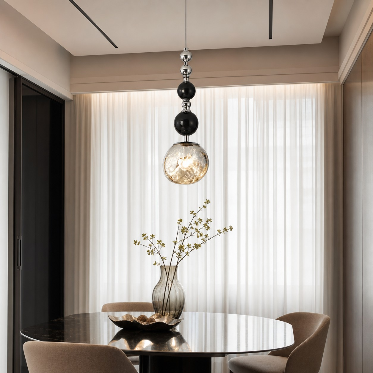 Luma beaded globe pendant light in a dining room
