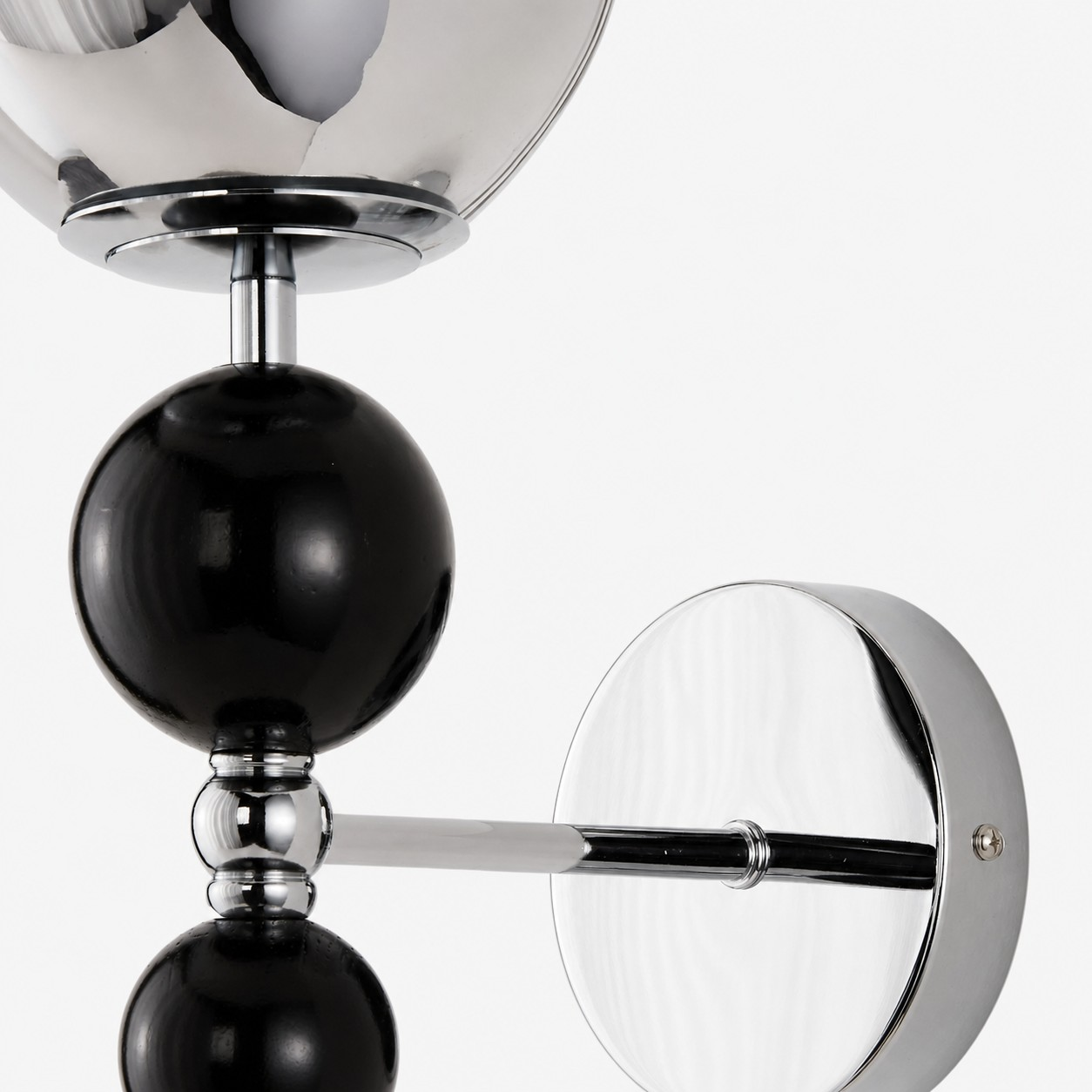 Chrome wall mount and black wood orb detail