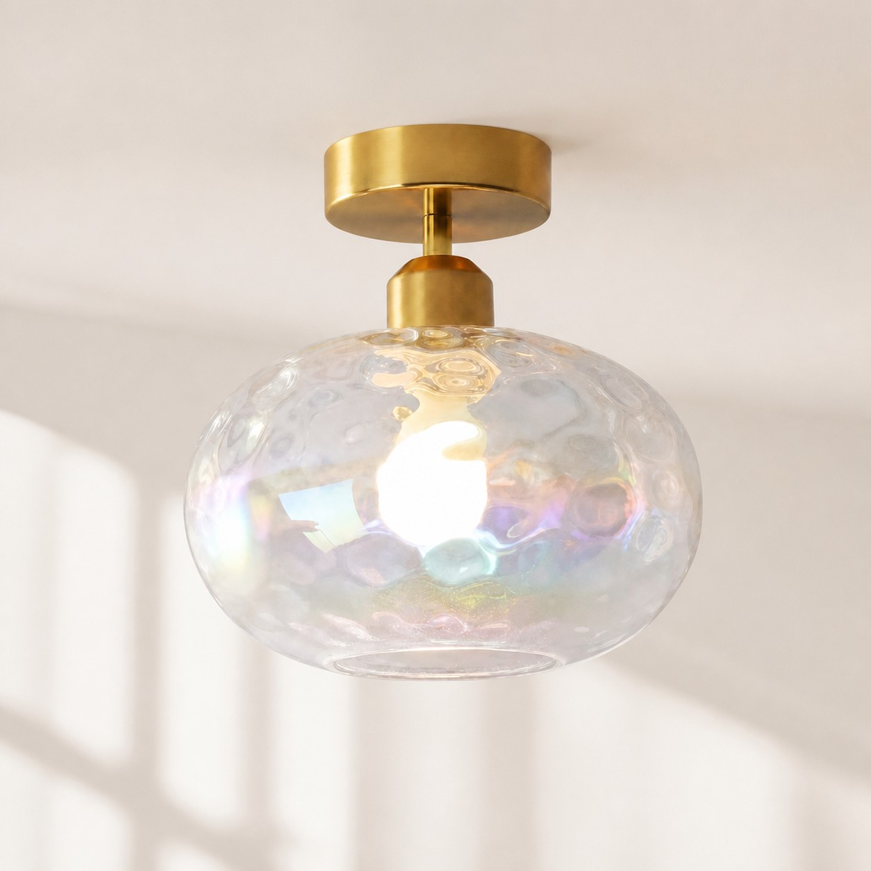 Compact globe ceiling lamp in a bedroom