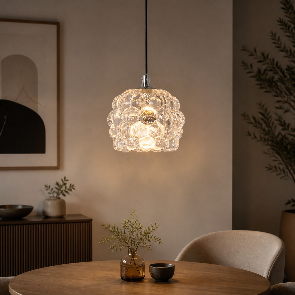Clear grape glass pendant glowing in a warm dining room