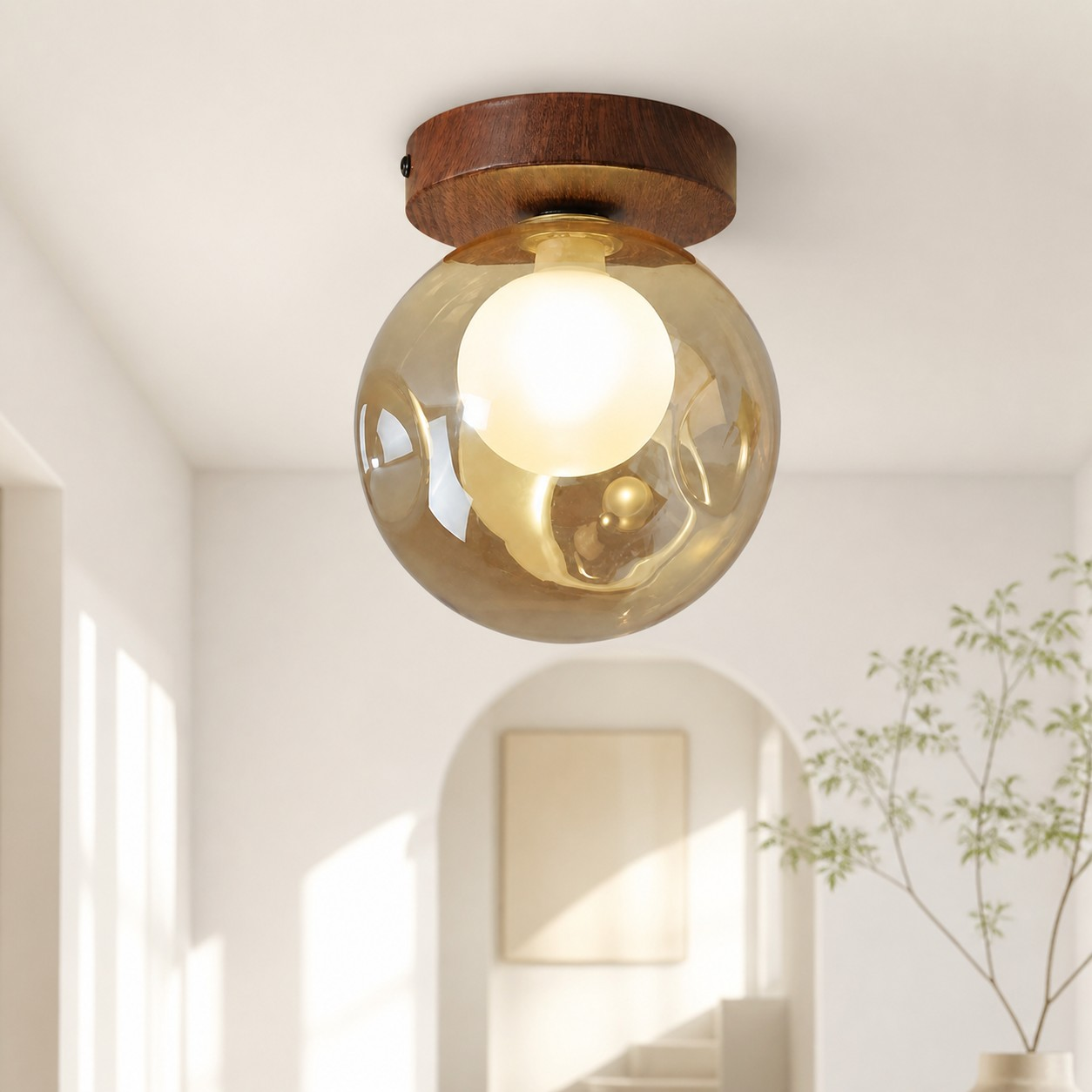Single-head amber globe ceiling light in a warm interior