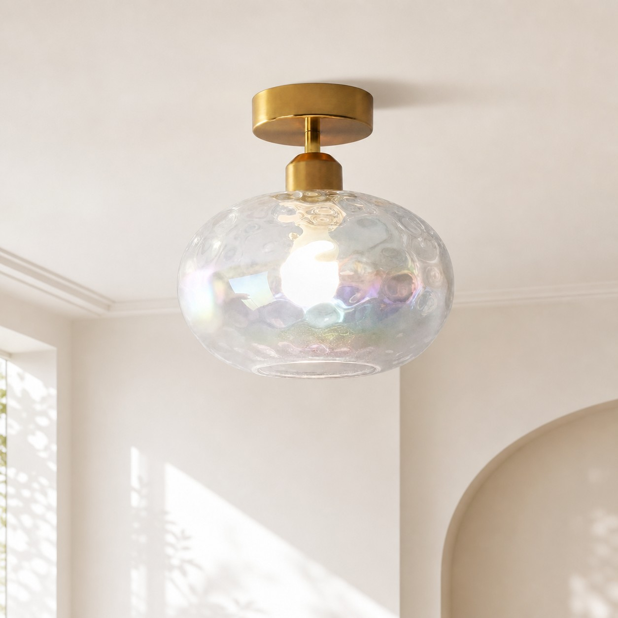 Iridescent globe ceiling lamp in a bright hallway