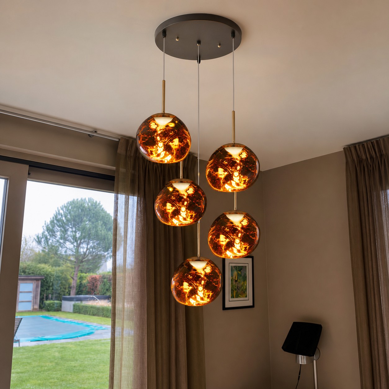 Gold five-head chandelier in a residential double-height interior