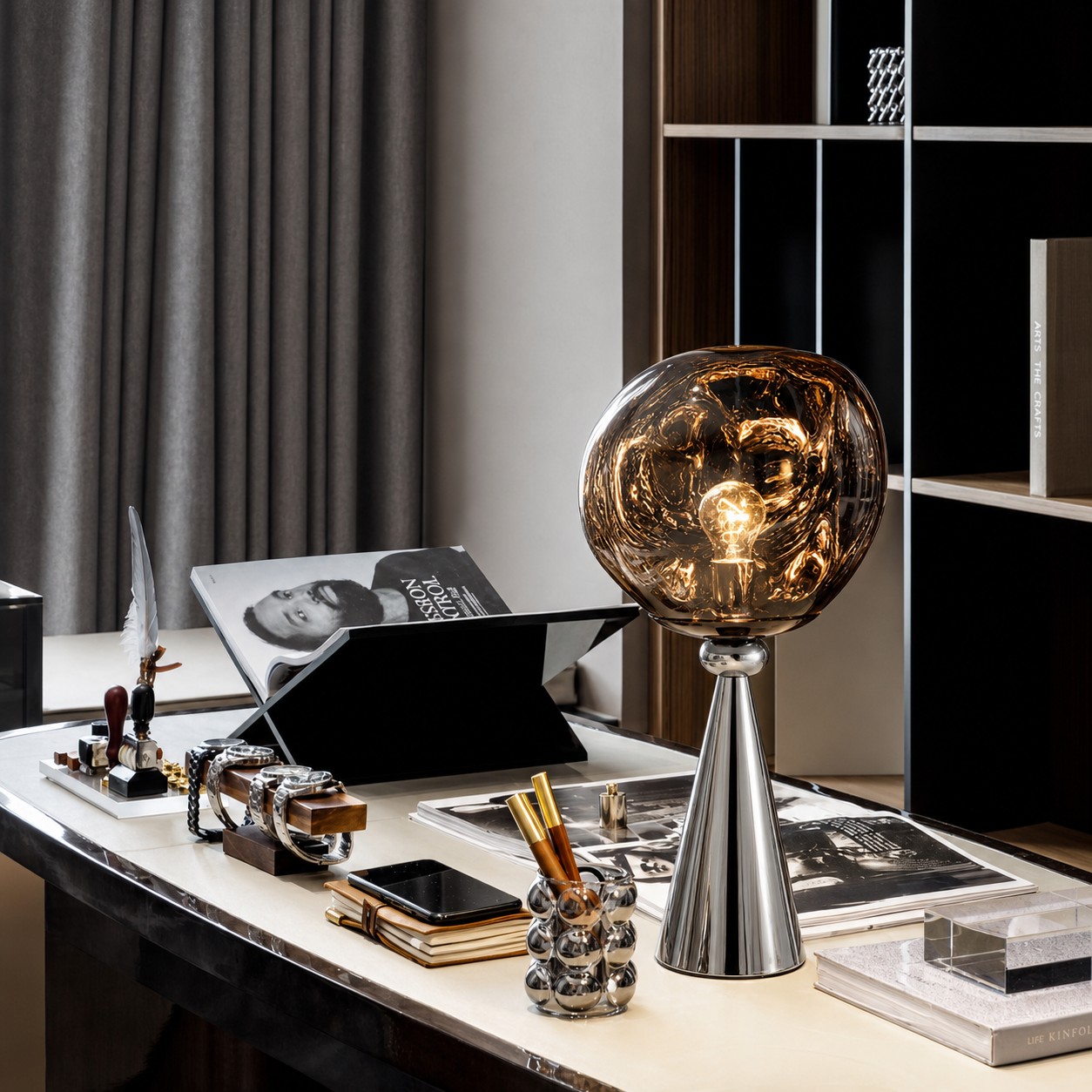 Chrome and smoke gray Lampa stolowa Lava Cone on a desk